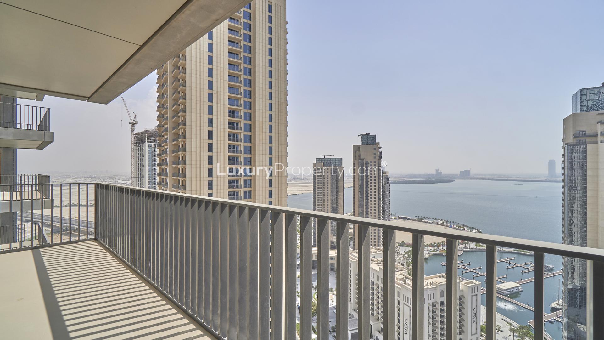 Spacious living area in 2-bedroom apartment, Dubai Creek Harbour, with balcony and harbour views