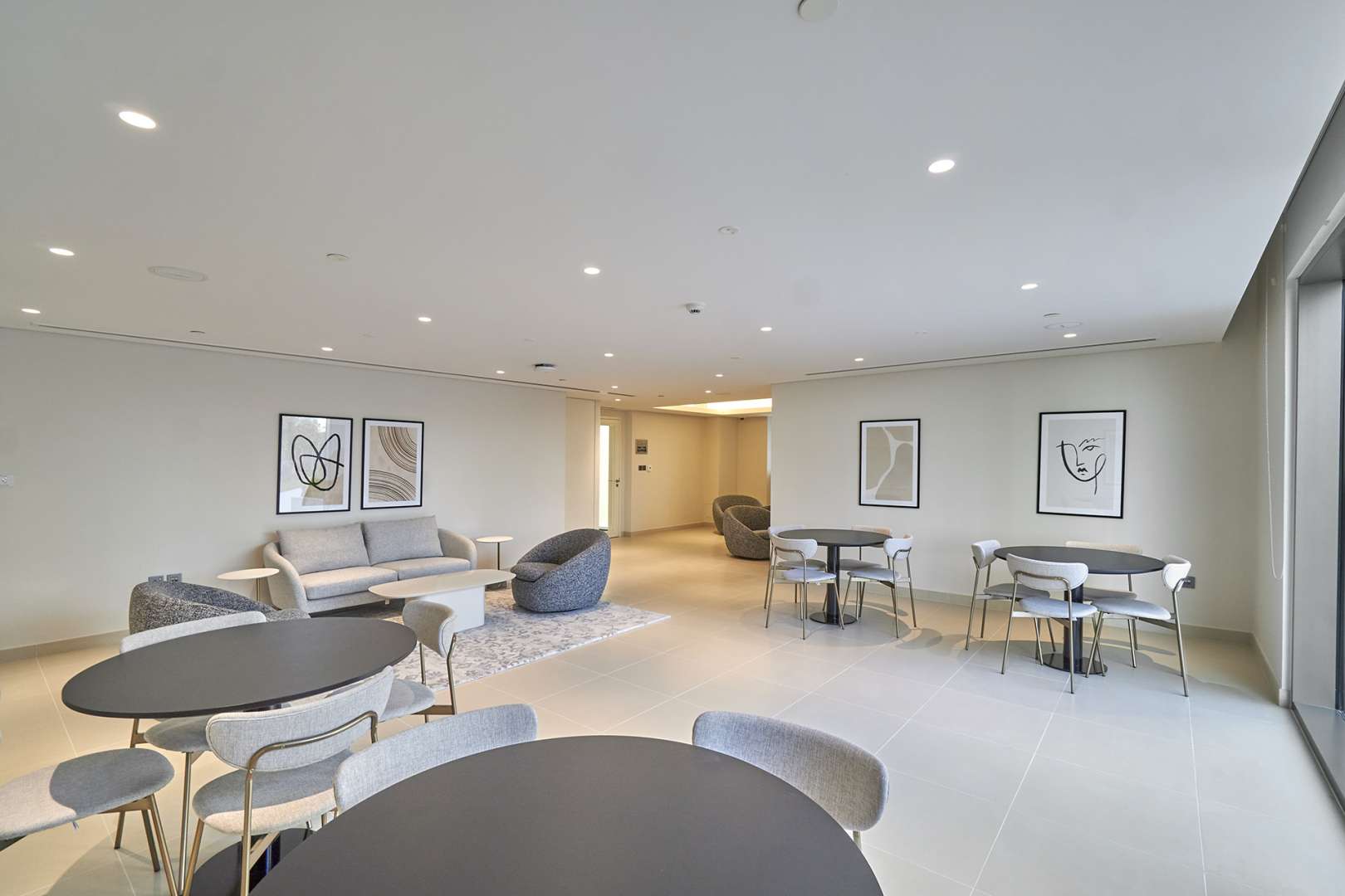 Modern living room in Creekside 18 apartment, Dubai Creek Harbour, featuring stylish seating area