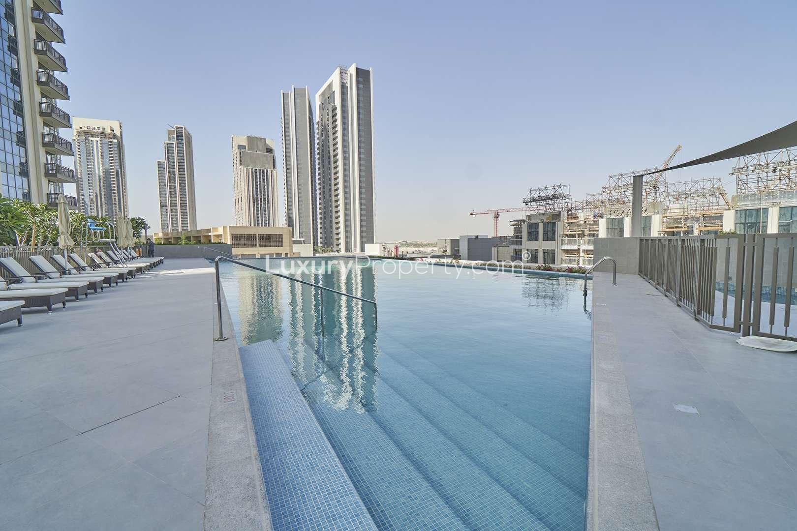 Modern open-plan kitchen and living area in Creekside 18 apartment, Dubai Creek Harbour