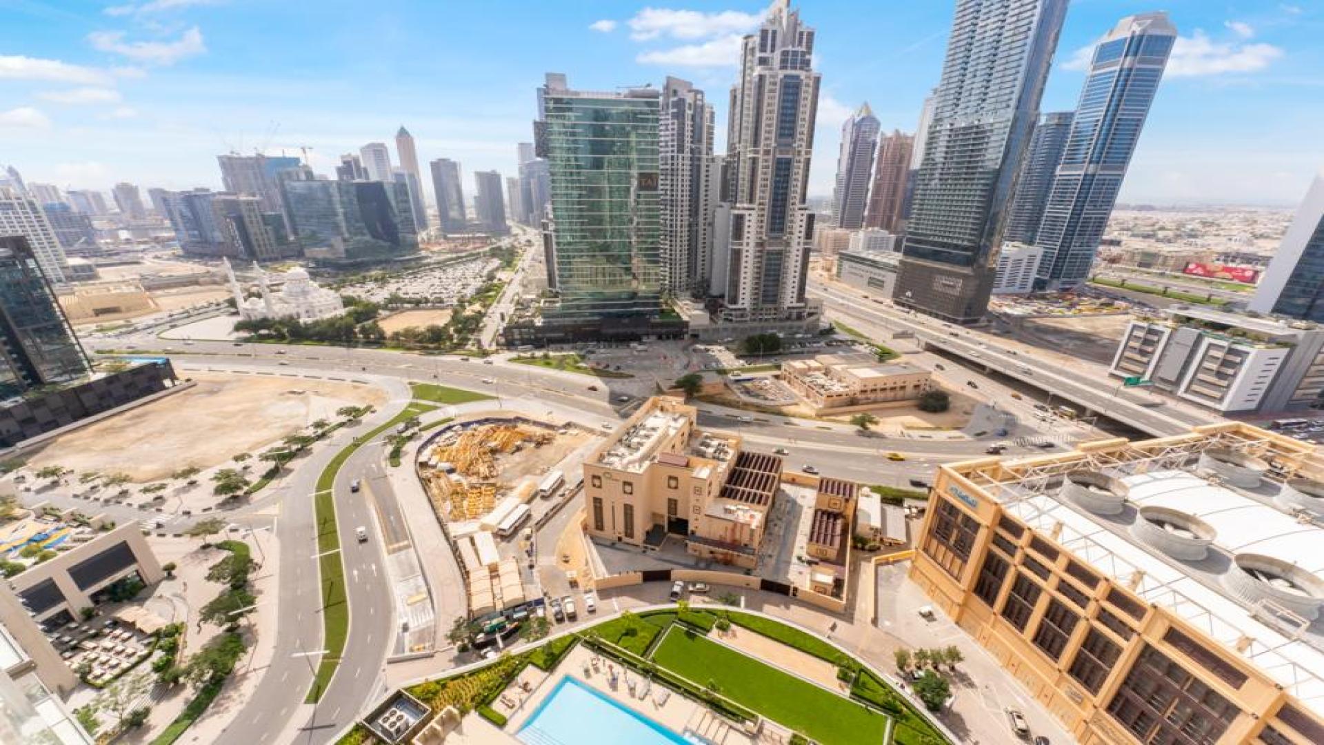 Modern furnished living room with city view in Burj Crown apartment, Downtown Dubai