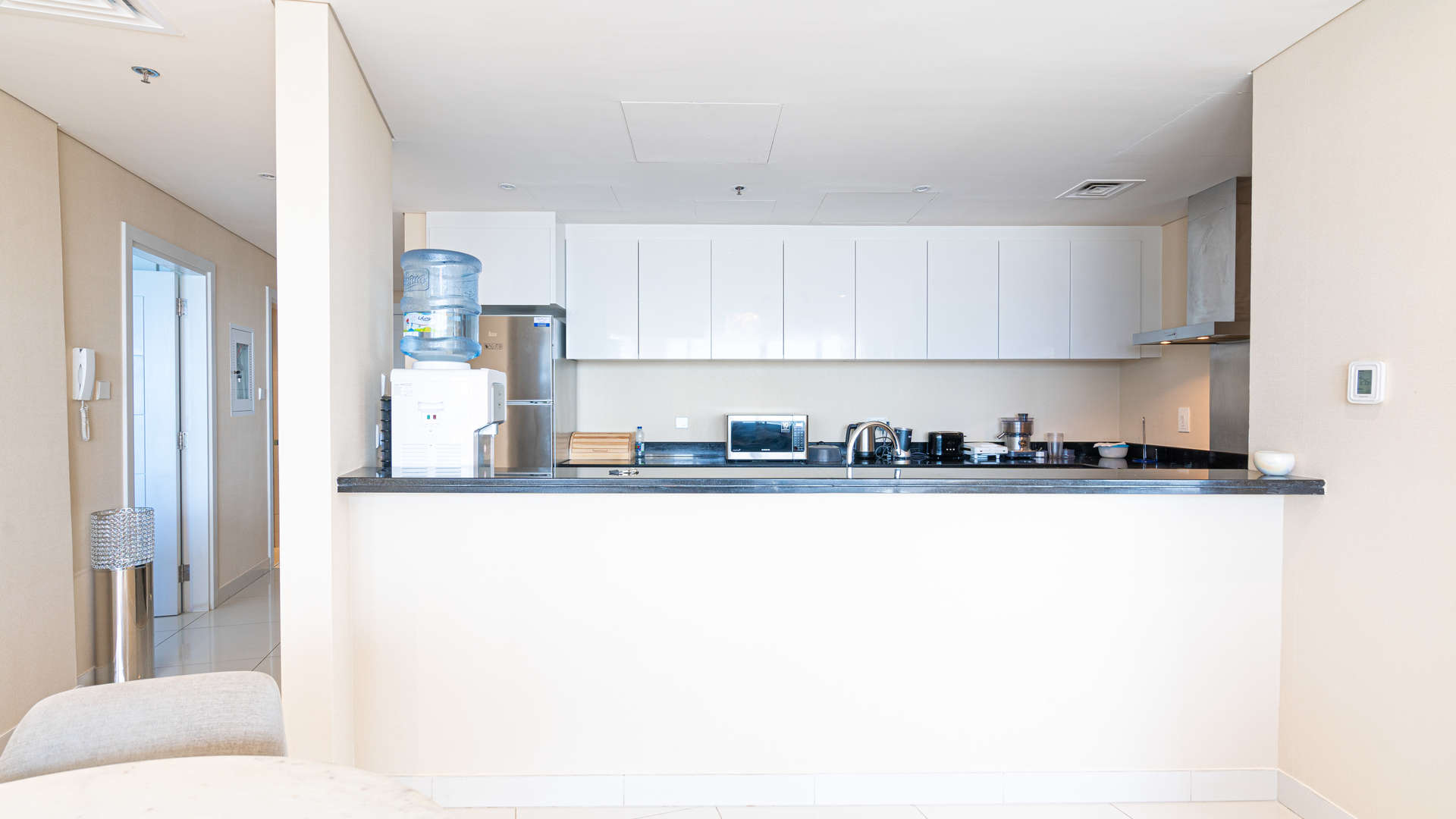 Modern kitchen in 2-bedroom apartment, Damac Heights, Dubai Marina, featuring sleek black countertops