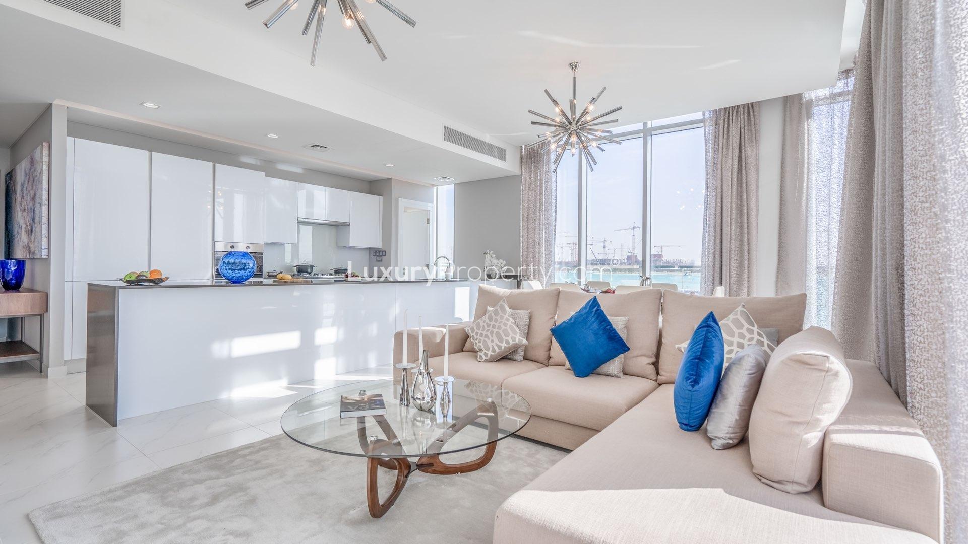 Furnished lagoon-facing apartment living room with modern decor in District One, Mohammed Bin Rashid City