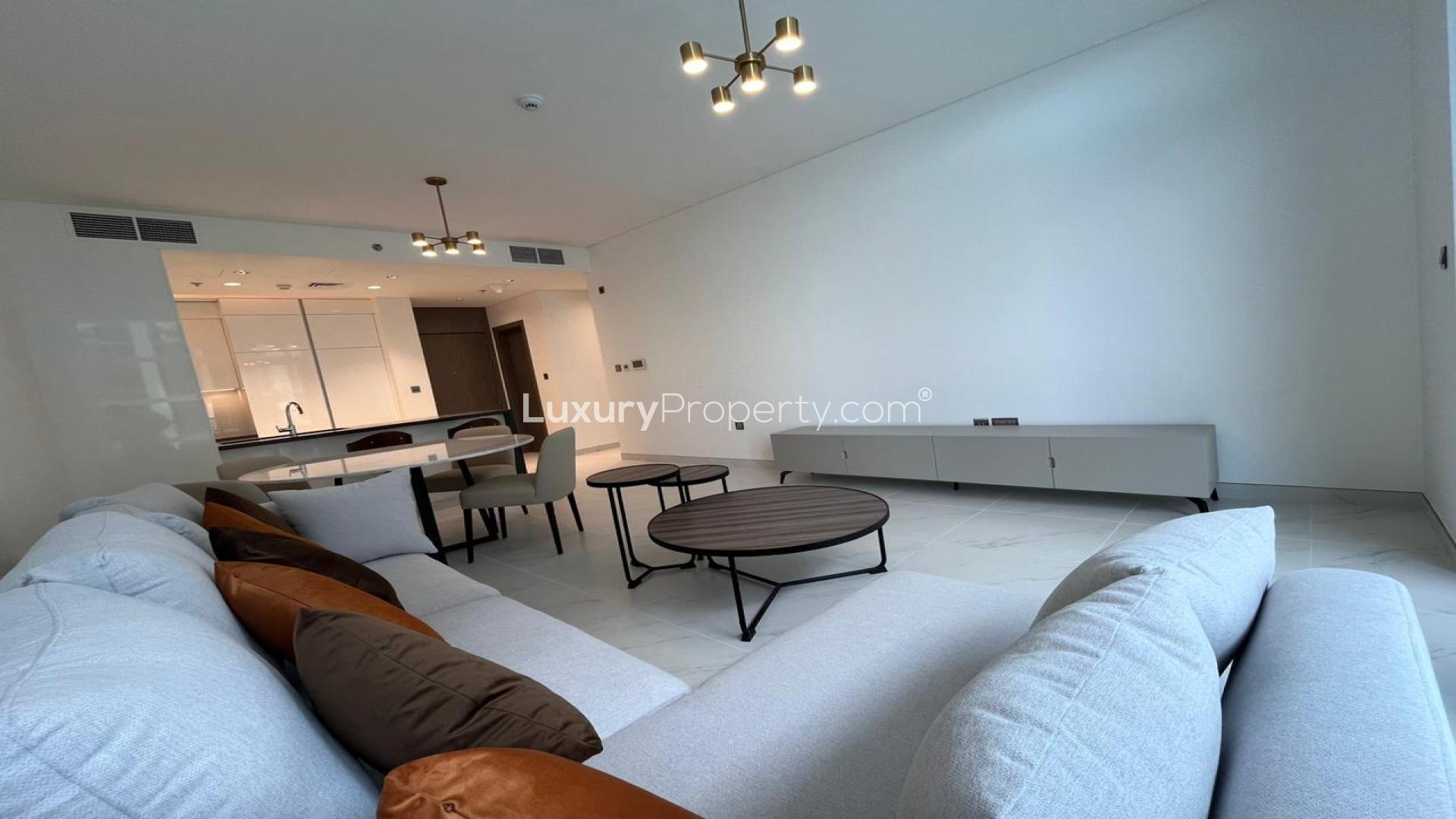 Modern kitchen and living area in lagoon-facing 2-bedroom apartment, MBR City District One