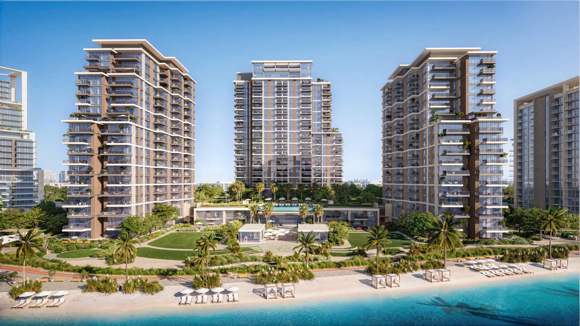 Modern apartment buildings in District One, Mohammed Bin Rashid City, overlooking a serene waterfront