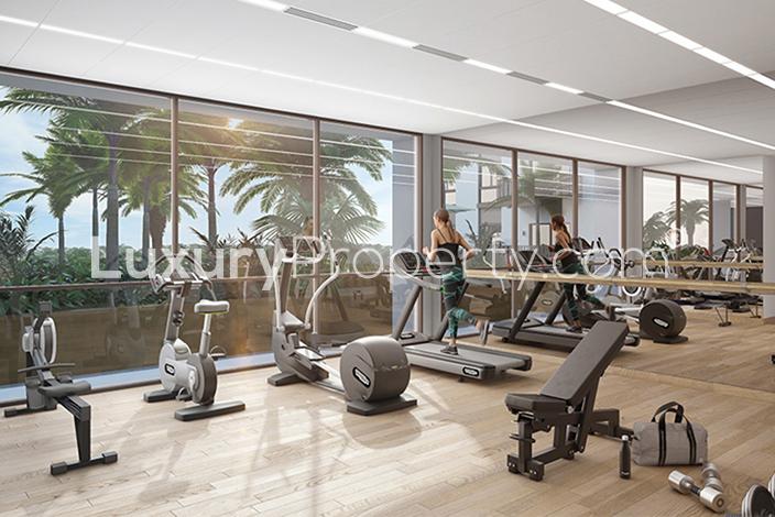 Eaton Palace luxury apartment lobby with modern elevators, Jumeirah Village Circle