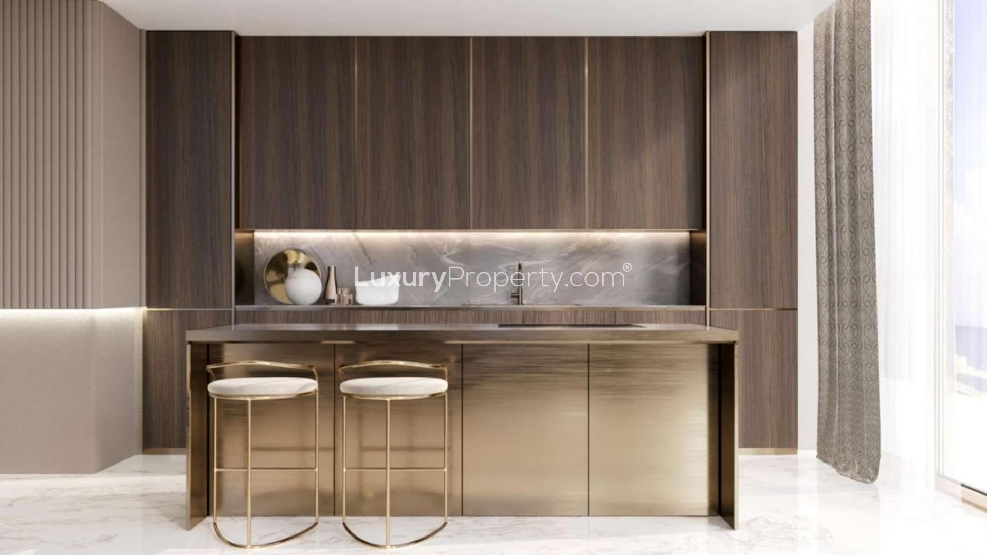 Luxury kitchen in beachfront apartment designed by Elie Saab, featuring elegant finishes