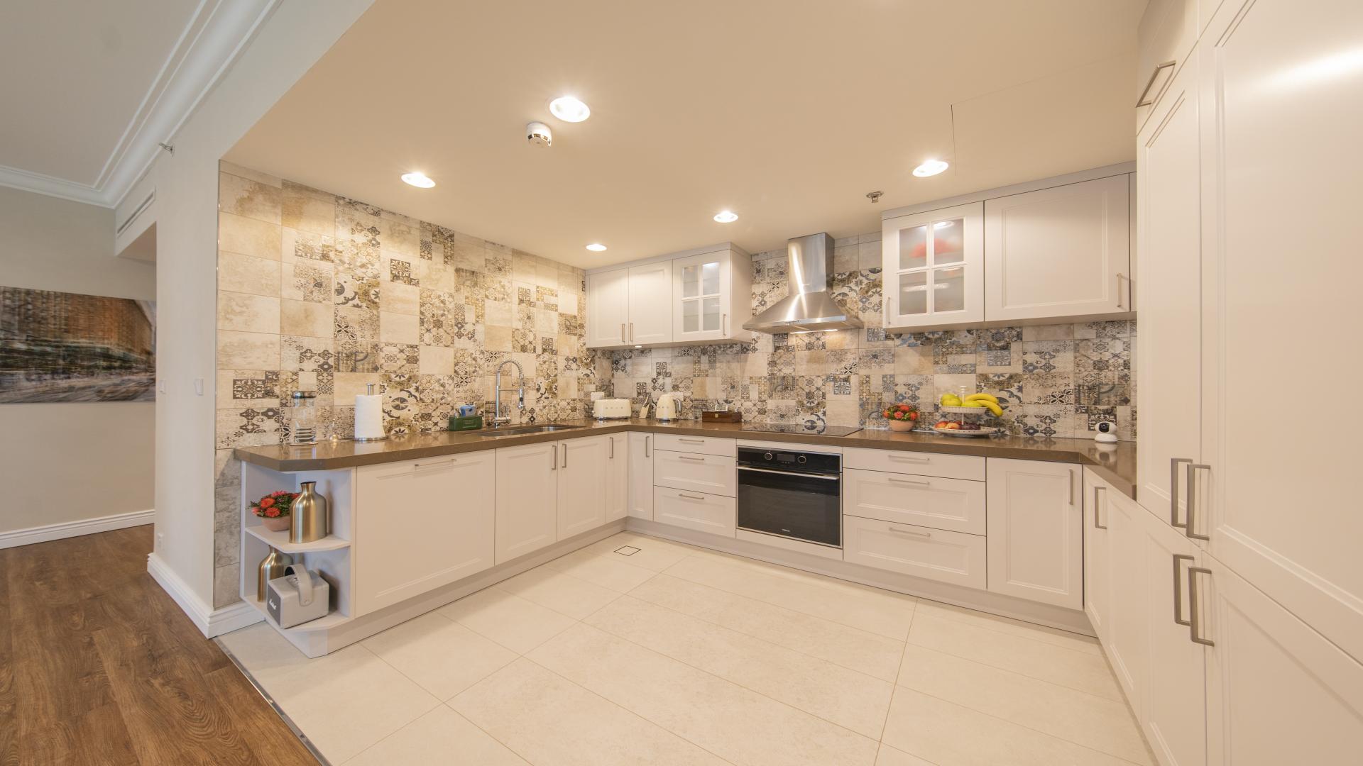 Modern kitchen with patterned backsplash in fully upgraded Dubai Marina apartment, Emaar 6 Towers