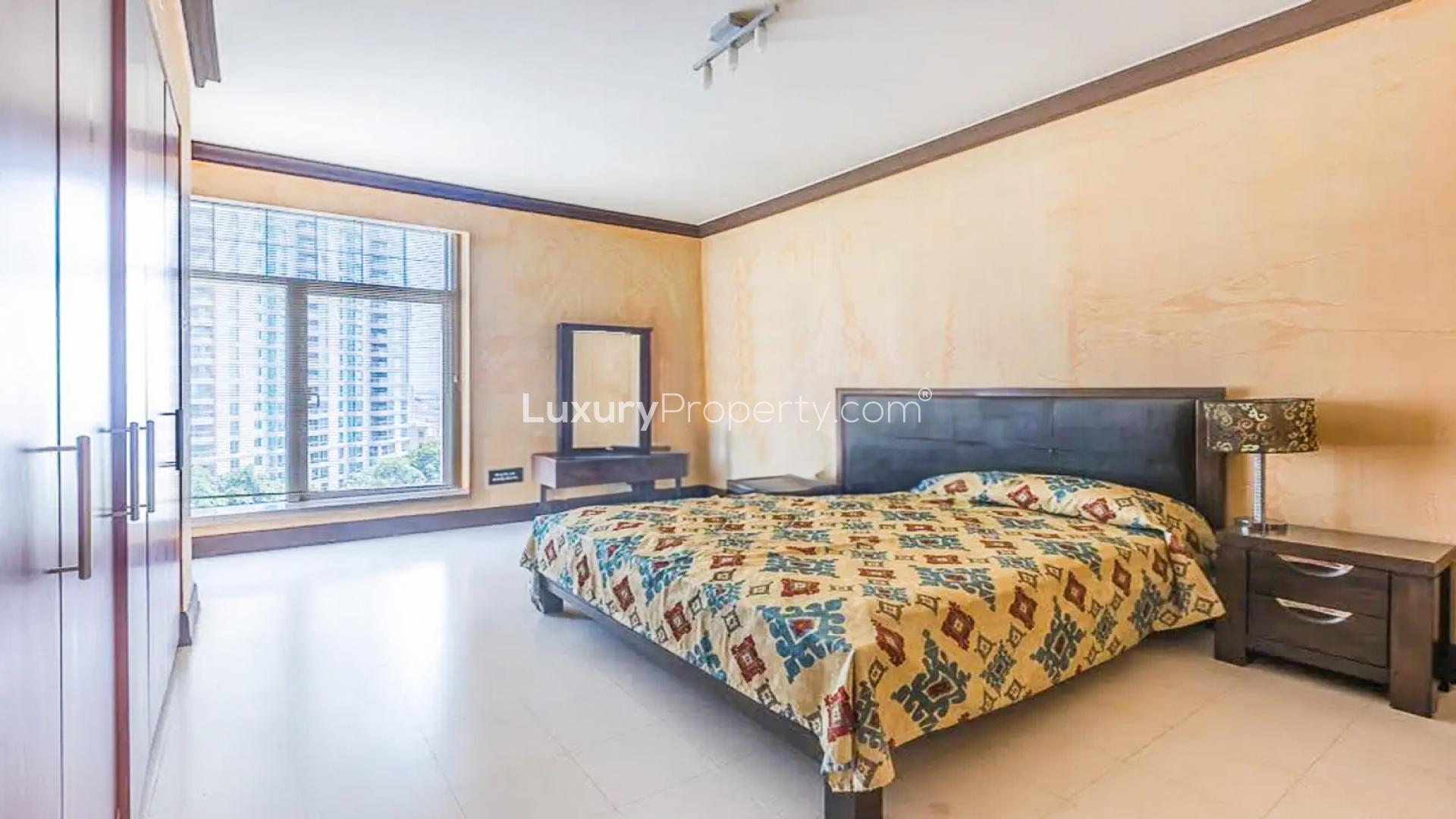 Luxurious bedroom in Al Anbar Tower apartment, Dubai Marina with modern decor and large window