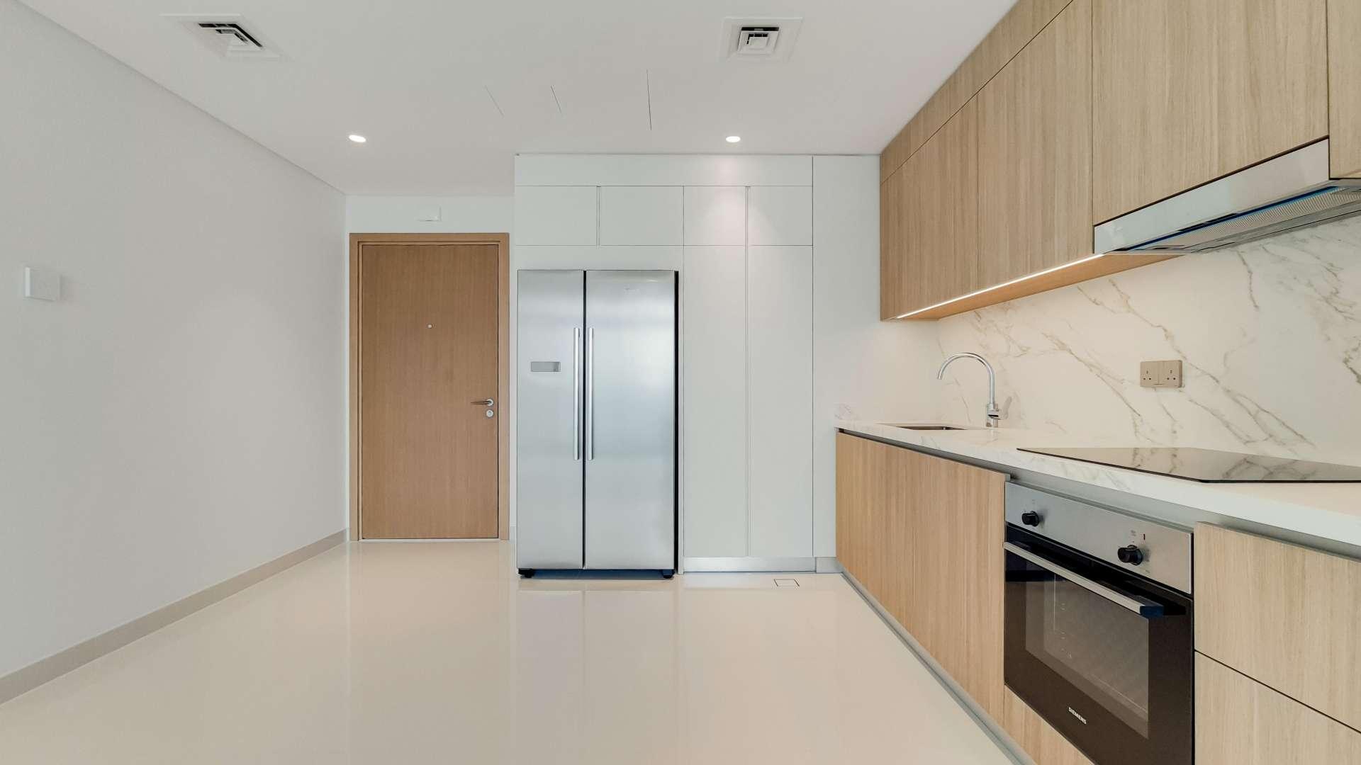 Empty modern apartment interior at Emaar Beachfront, Dubai Harbour, with sleek finishes