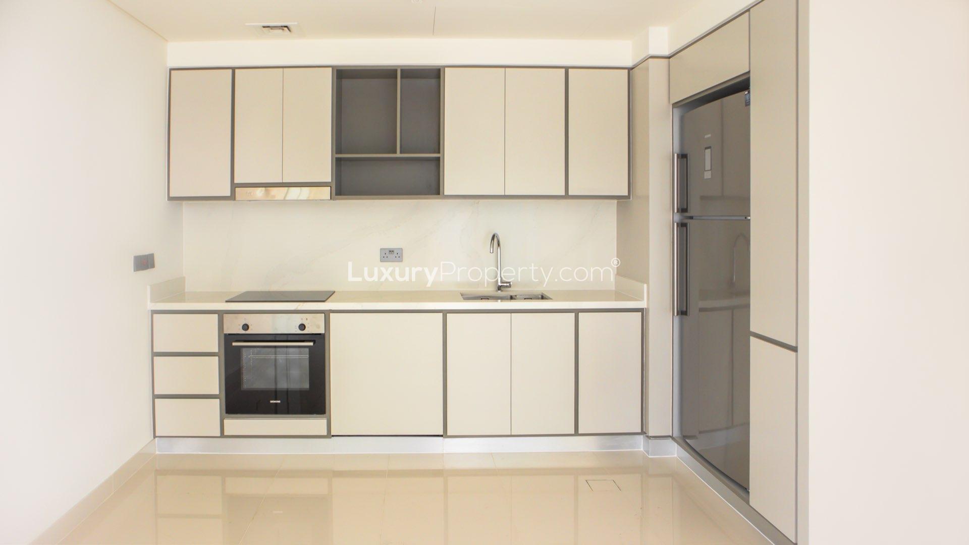 Modern kitchen in 2-bed apartment, Emaar Beachfront, Dubai Harbour, with sleek cabinetry and appliances