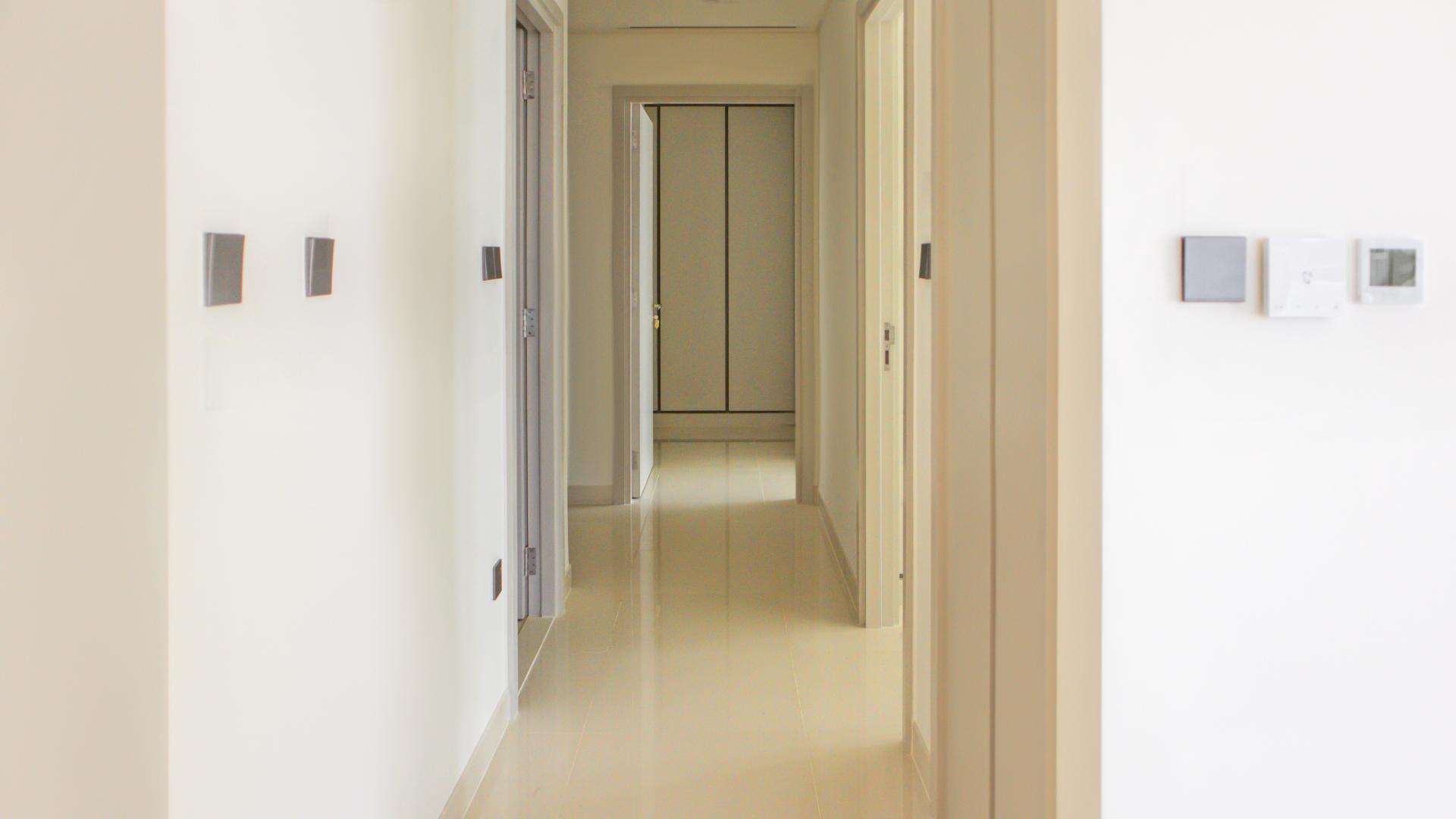 Bright hallway in Emaar Beachfront apartment, Dubai Harbour, featuring modern design and sleek finishes