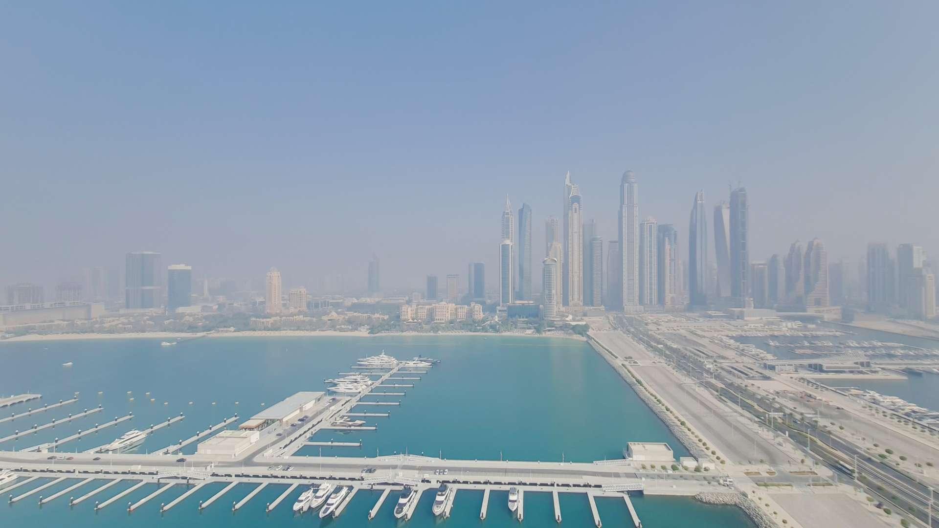 N/A,Penthouse apartment view of Dubai Marina skyline and waterfront at Emaar Beachfront, Dubai Harbour