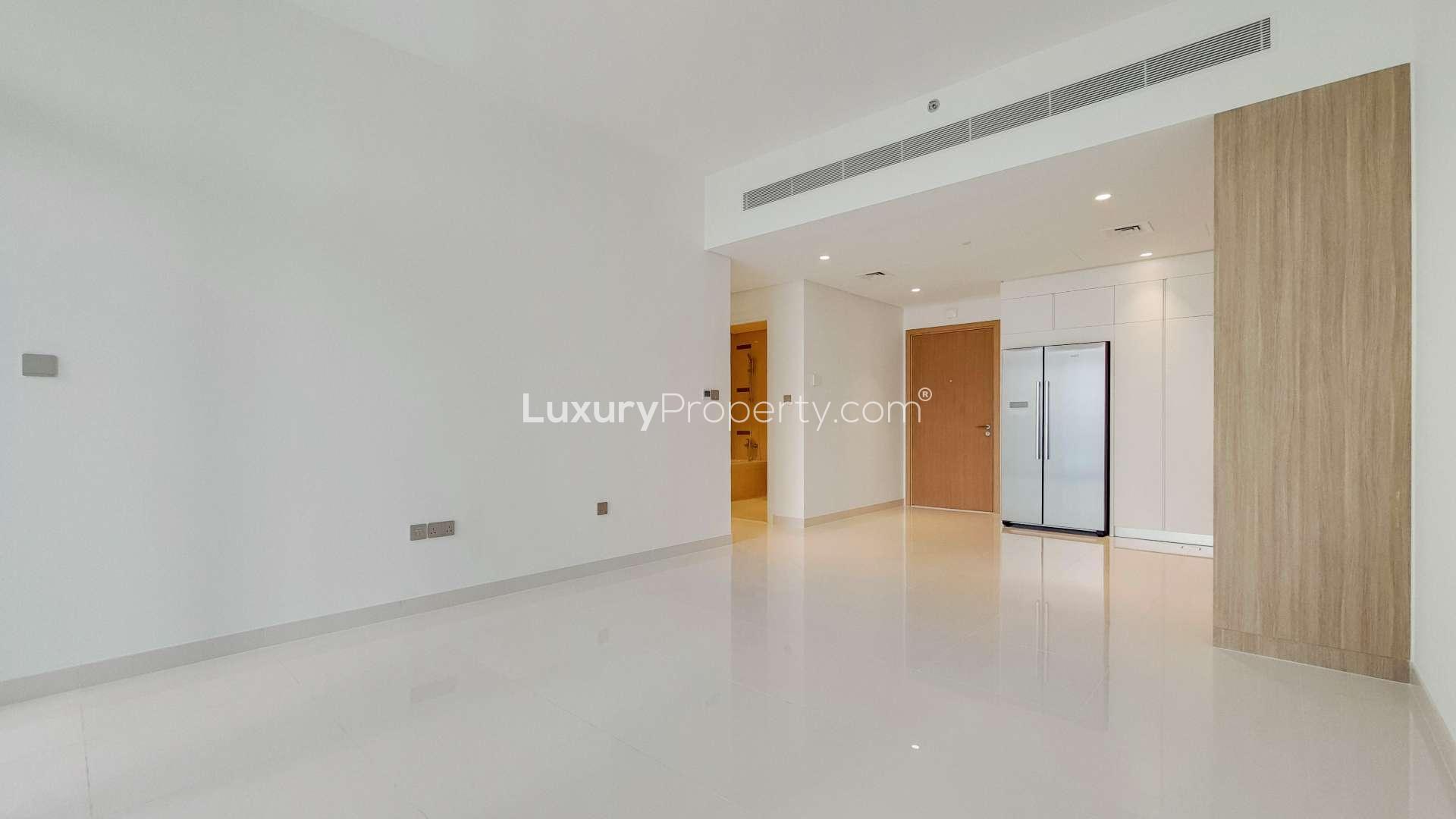 "Spacious living area in 2-bedroom apartment, Emaar Beachfront, Dubai Harbour, for sale.",Modern kitchen in 2-bedroom beachfront apartment, Emaar Beachfront, Dubai Harbour, property for sale