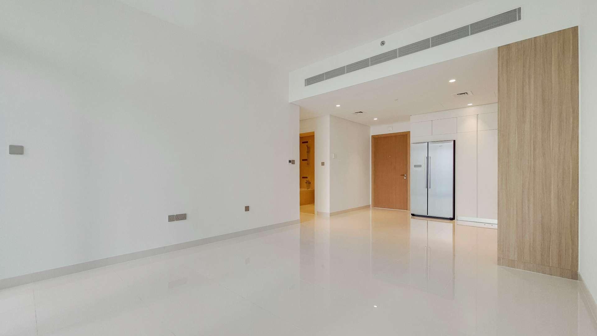 "Spacious living area in 2-bedroom apartment, Emaar Beachfront, Dubai Harbour, for sale.",Modern kitchen in 2-bedroom beachfront apartment, Emaar Beachfront, Dubai Harbour, property for sale