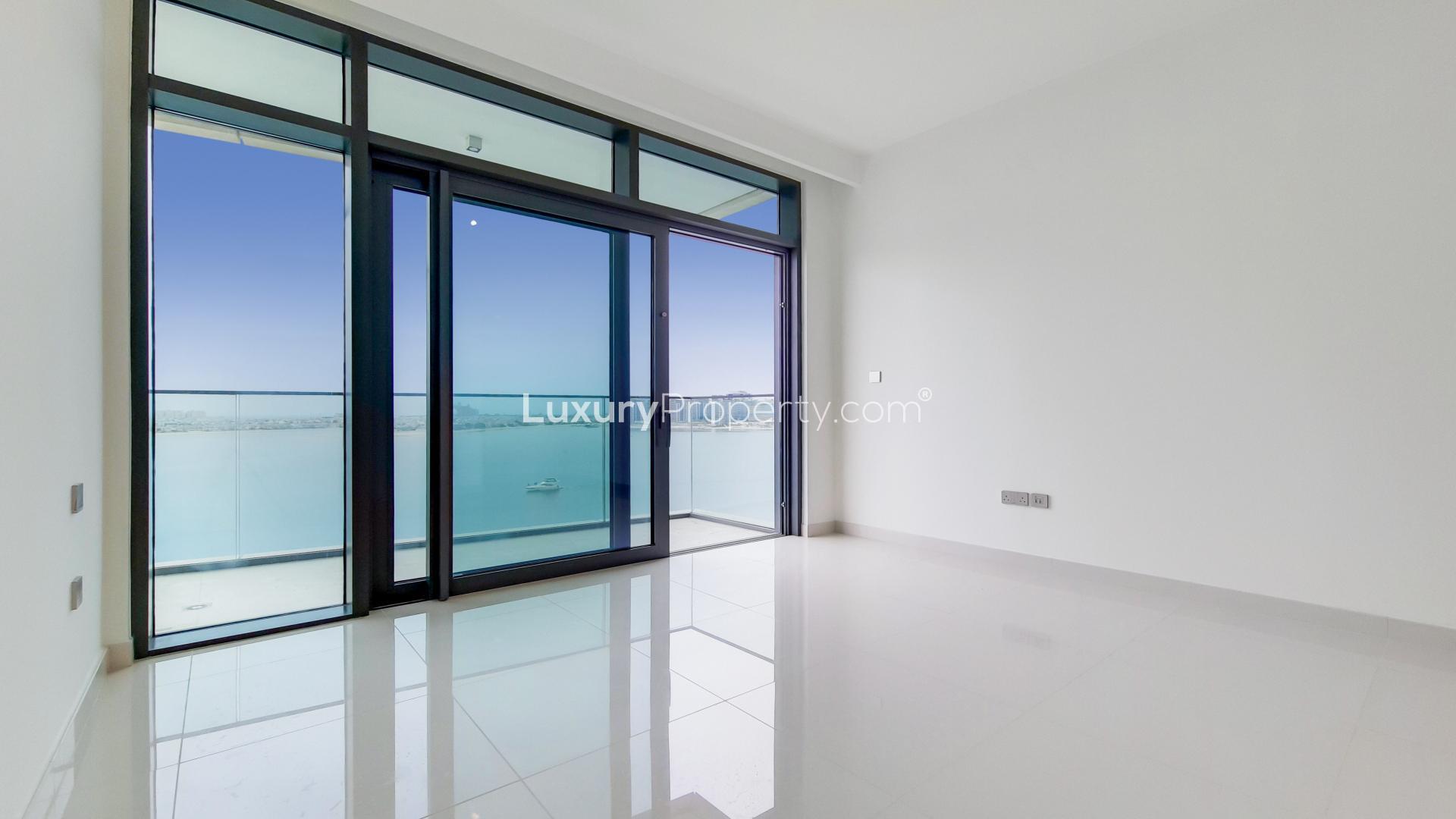 Brand new Emaar Beachfront apartment interior with ocean view balcony in Dubai Harbour