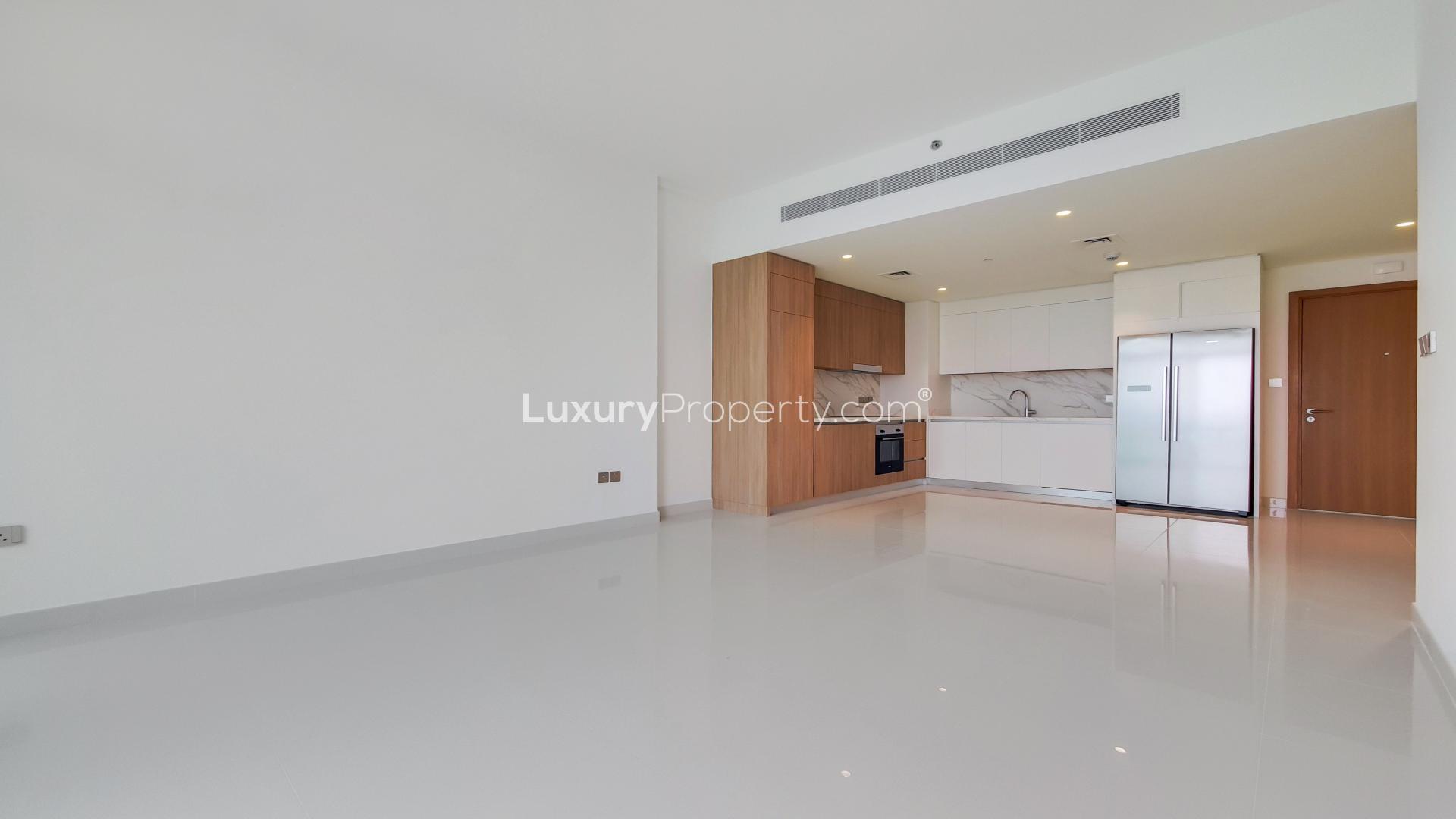 "Stunning sea view from balcony of Emaar Beachfront two-bedroom apartment in Dubai Harbour.",Brand new two-bedroom apartment kitchen and living area in Emaar Beachfront, Dubai Harbour