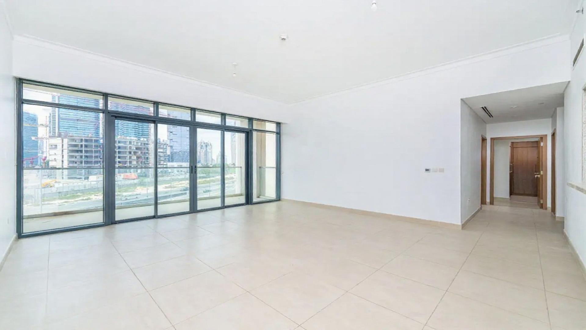 Contemporary apartment living room with large windows at Vida Residences The Hills Dubai