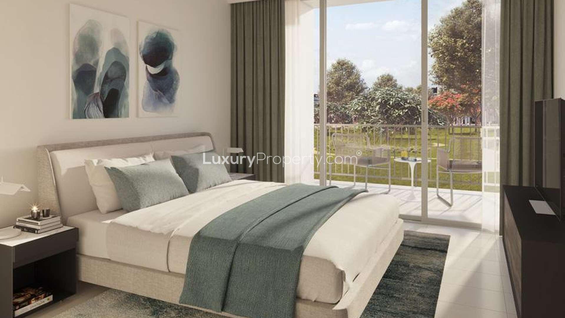 Stylish bedroom with balcony view in Dubai Hills Estate apartment for sale