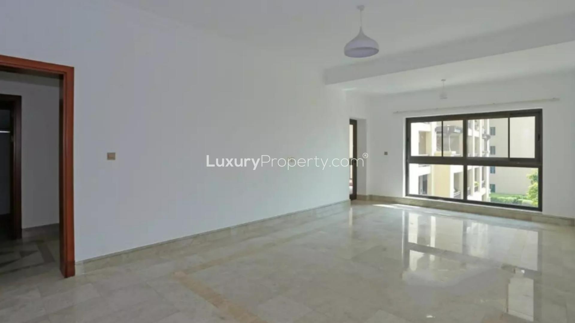 Palm Jumeirah Fairmont South apartment view with lush greenery and sea in background