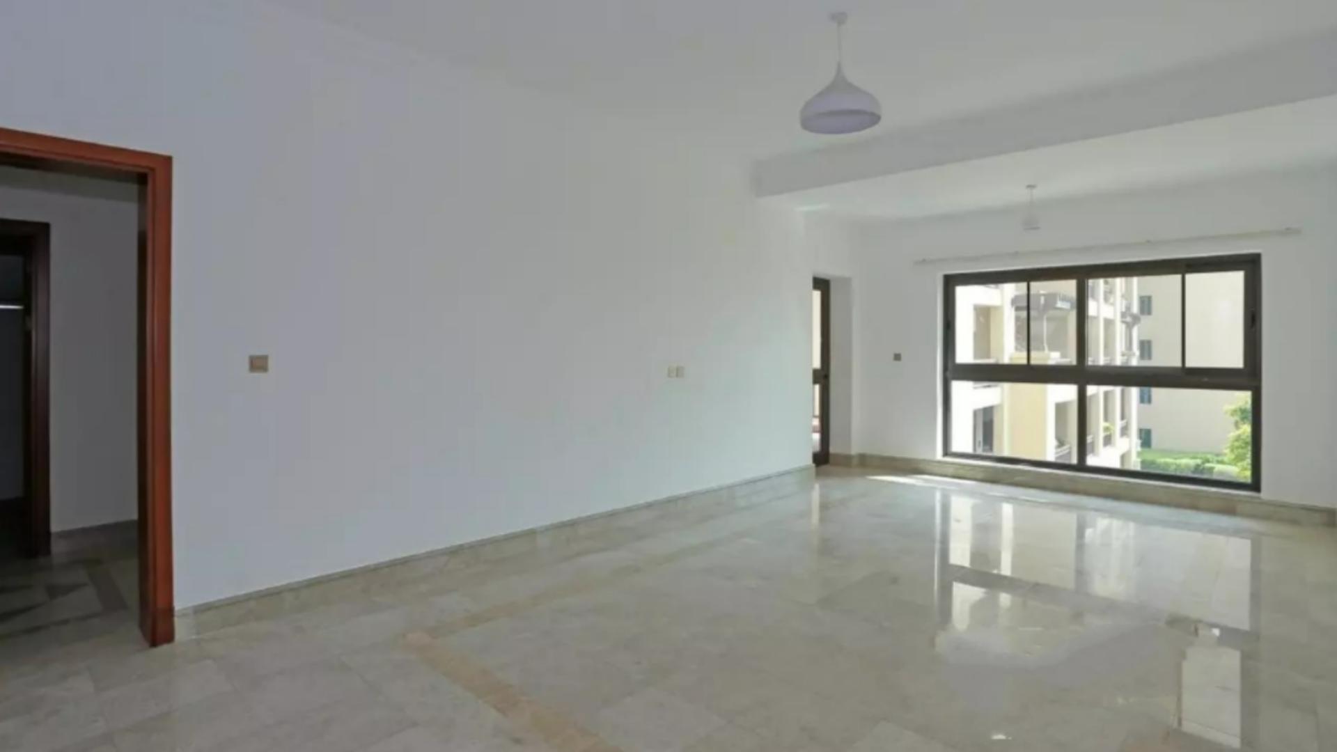 Palm Jumeirah Fairmont South apartment view with lush greenery and sea in background