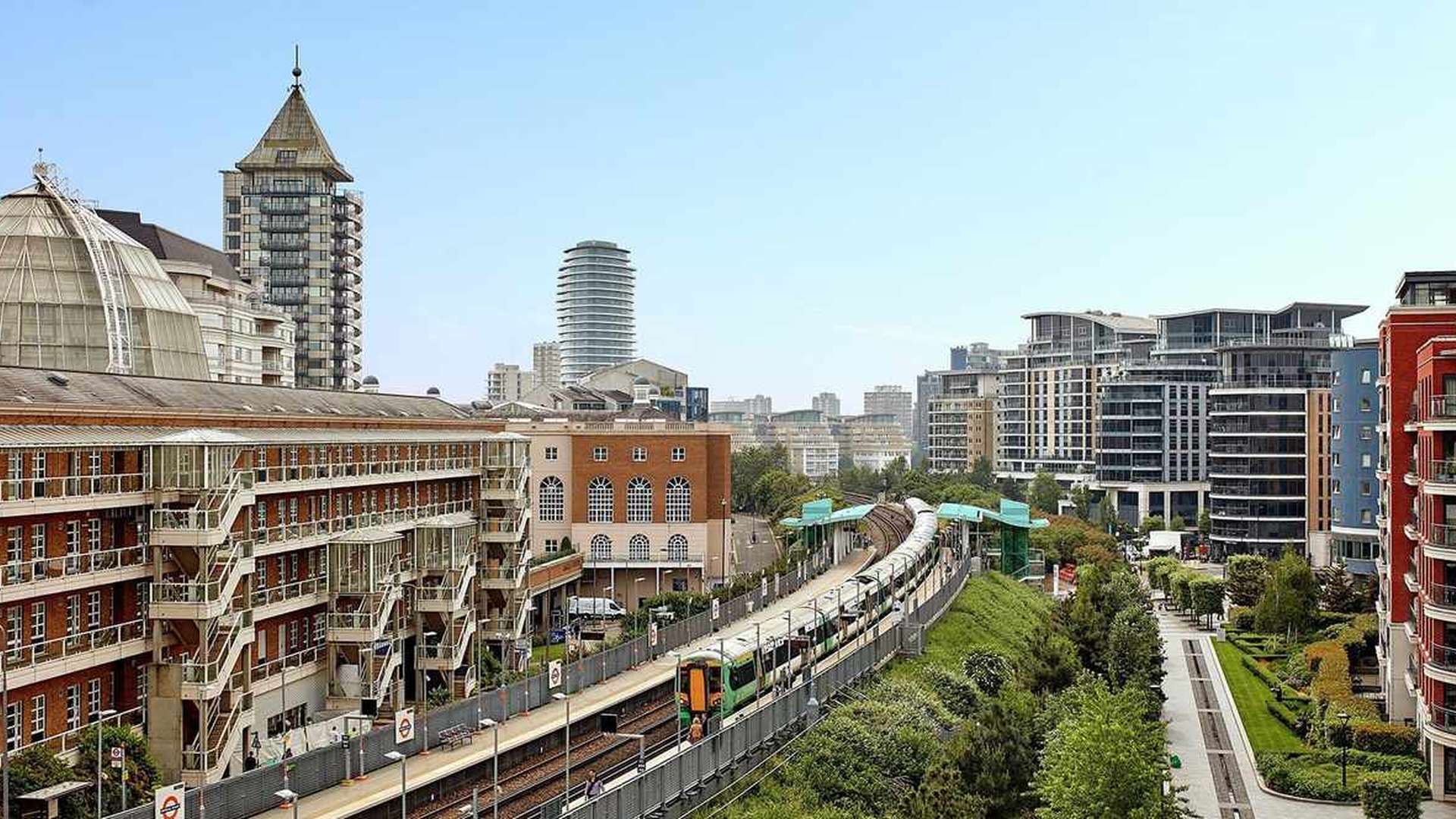 "Modern apartment exterior at Fairwater House, Chelsea Creek with canal view and balconies.",Aerial view of Chelsea Creek buildings near Fairwater House apartment for sale
