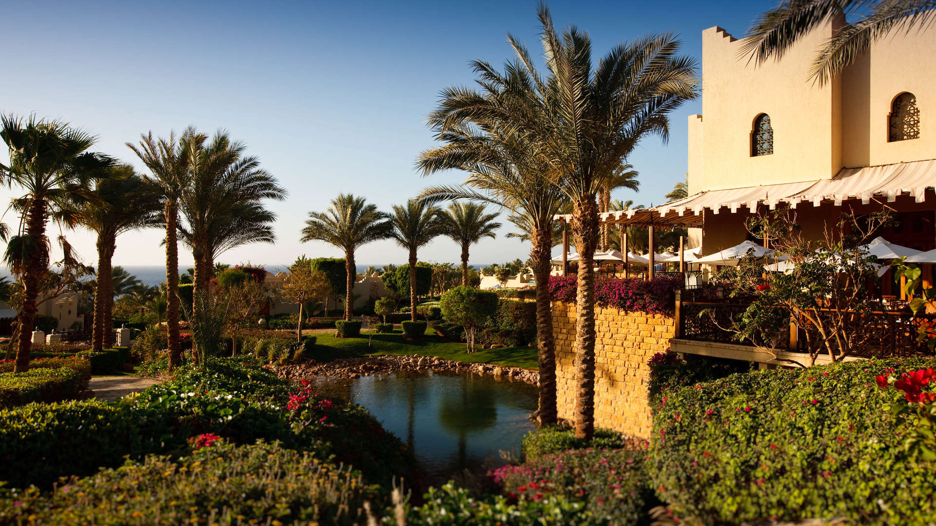 Living room in luxury two-bedroom chalet, Four Seasons Sharm El Sheikh, with balcony view