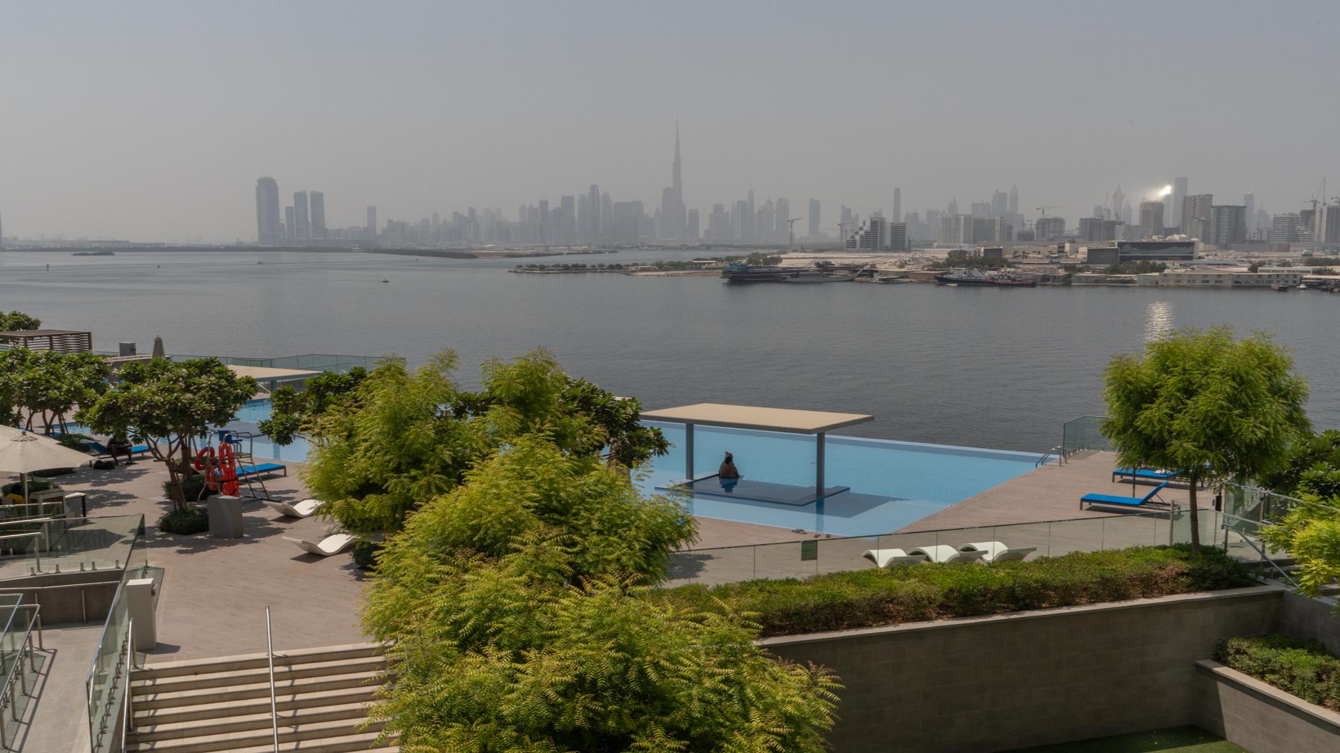 Dubai Creek Harbour apartment balcony view overlooking waterfront and skyline at The Grand