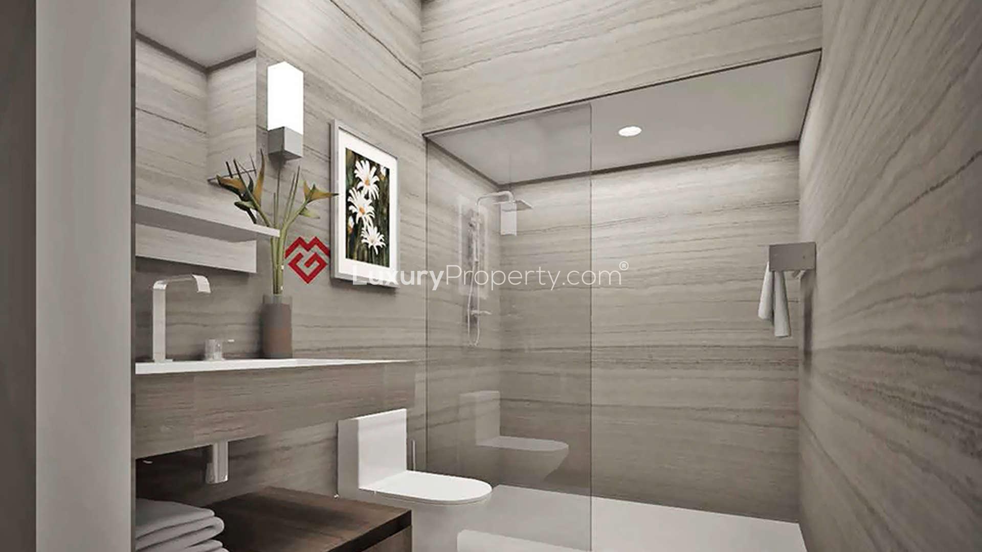 Modern bathroom in Genesis, Arjan apartment with glass shower and sleek design