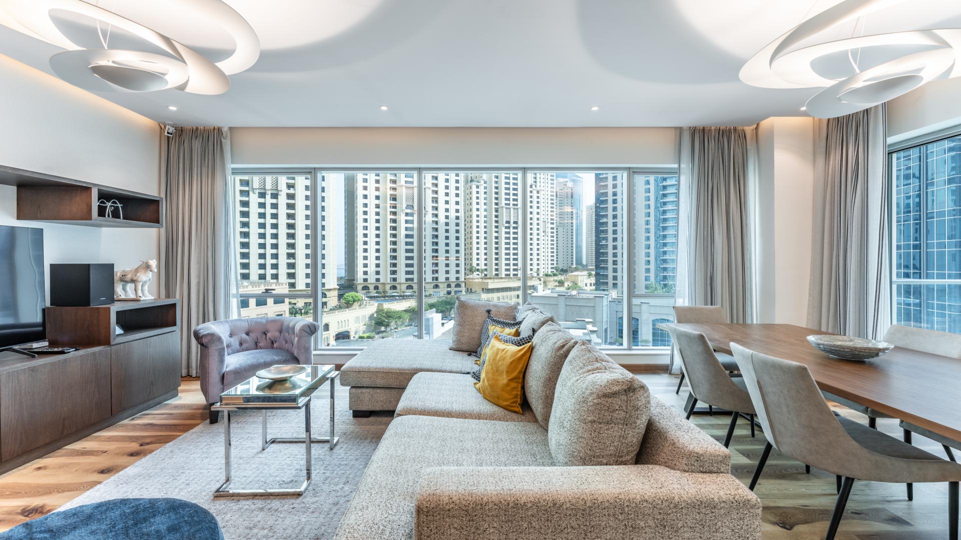 Balcony view from Shemara Tower apartment overlooking Dubai Marina skyline and waterfront