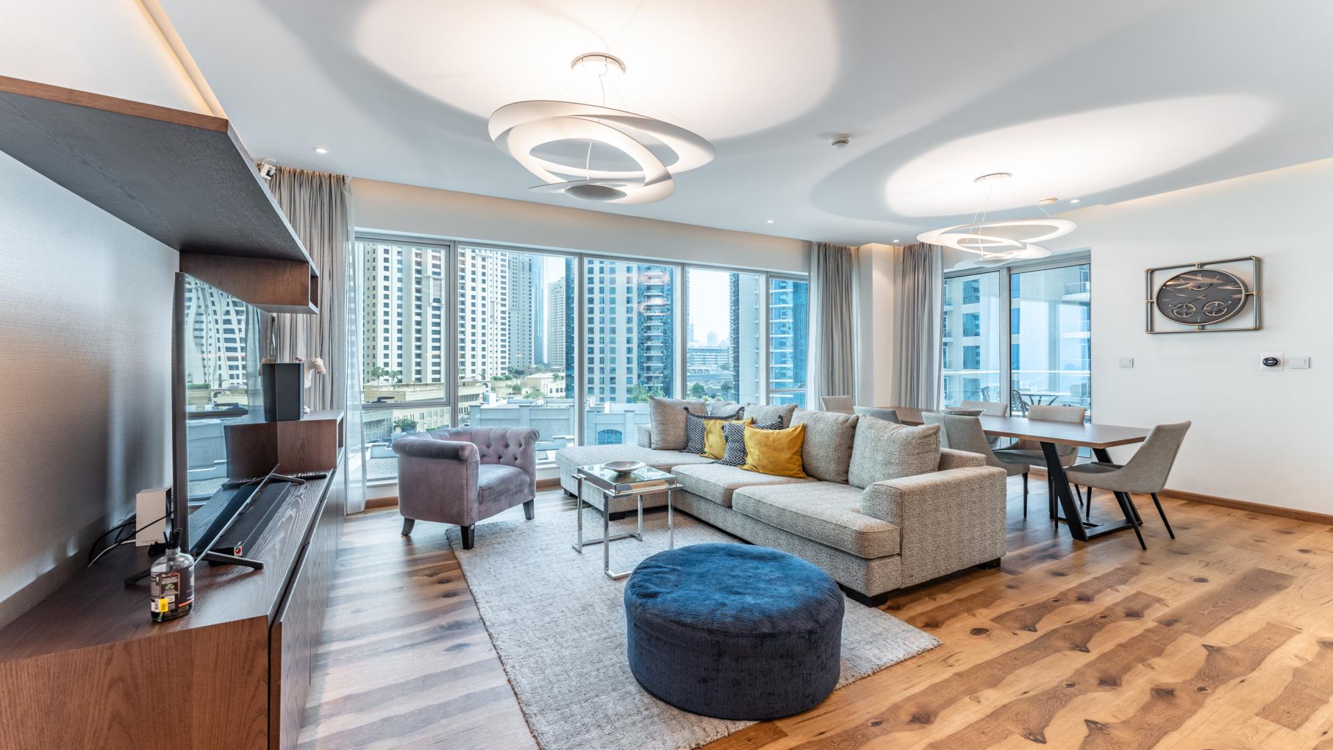 Fully furnished living room in Shemara Tower apartment, Dubai Marina, with modern decor