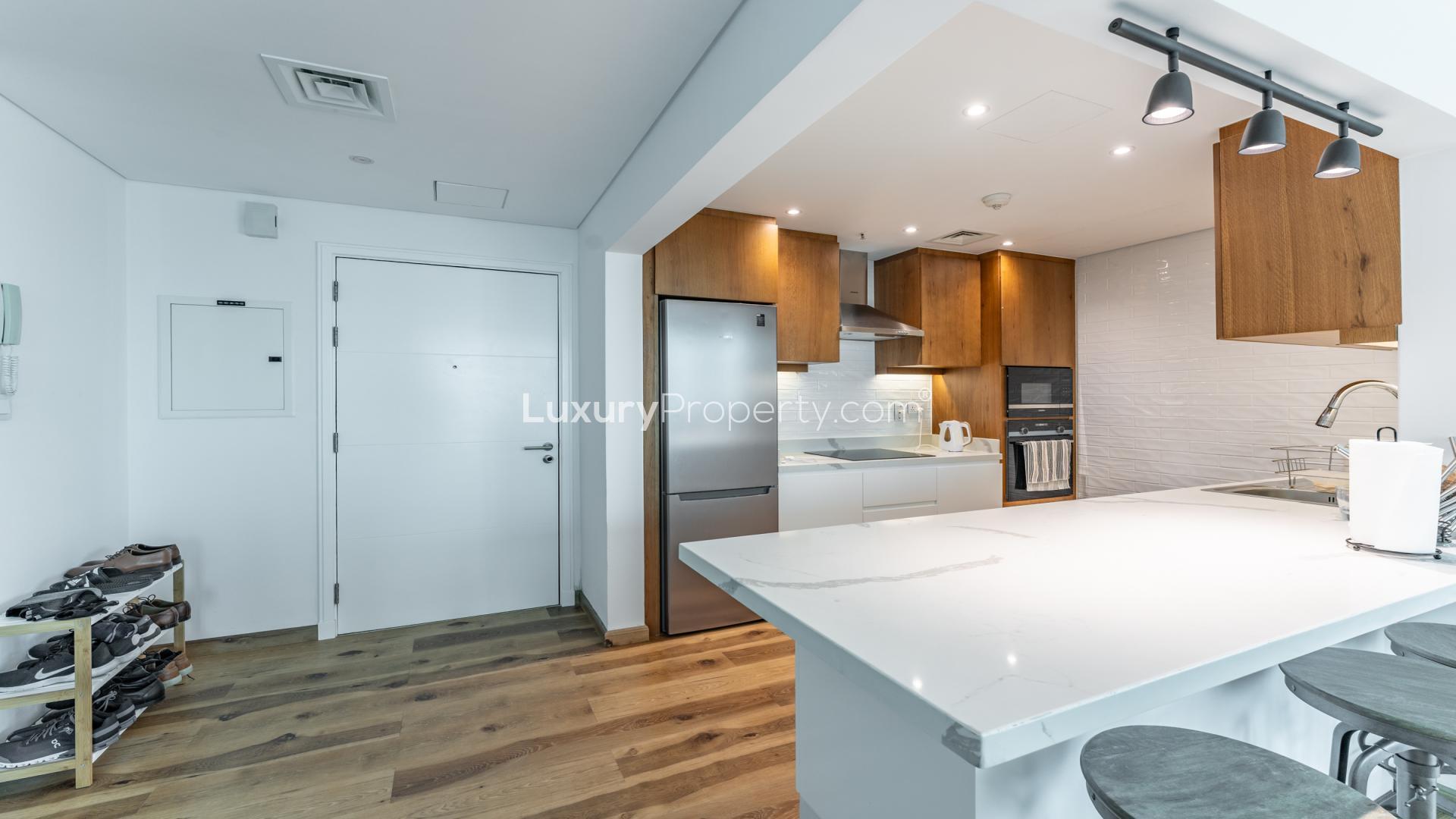 Modern kitchen in 2-bedroom apartment, Marina Promenade, Dubai Marina, featuring sleek design elements