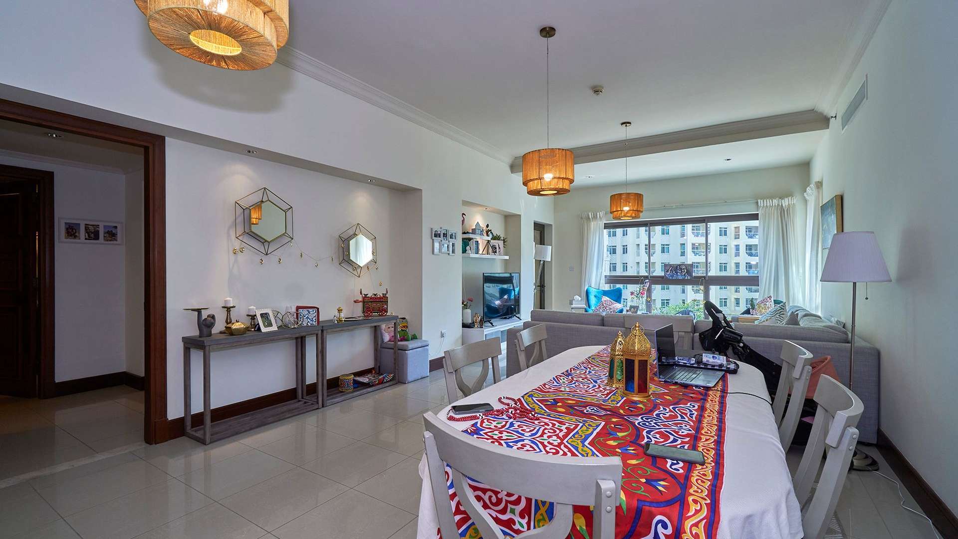 "Golden Mile apartment view, Palm Jumeirah, showcasing residential buildings and lush greenery.",Living room and dining area in spacious Palm Jumeirah apartment, Golden Mile, for sale