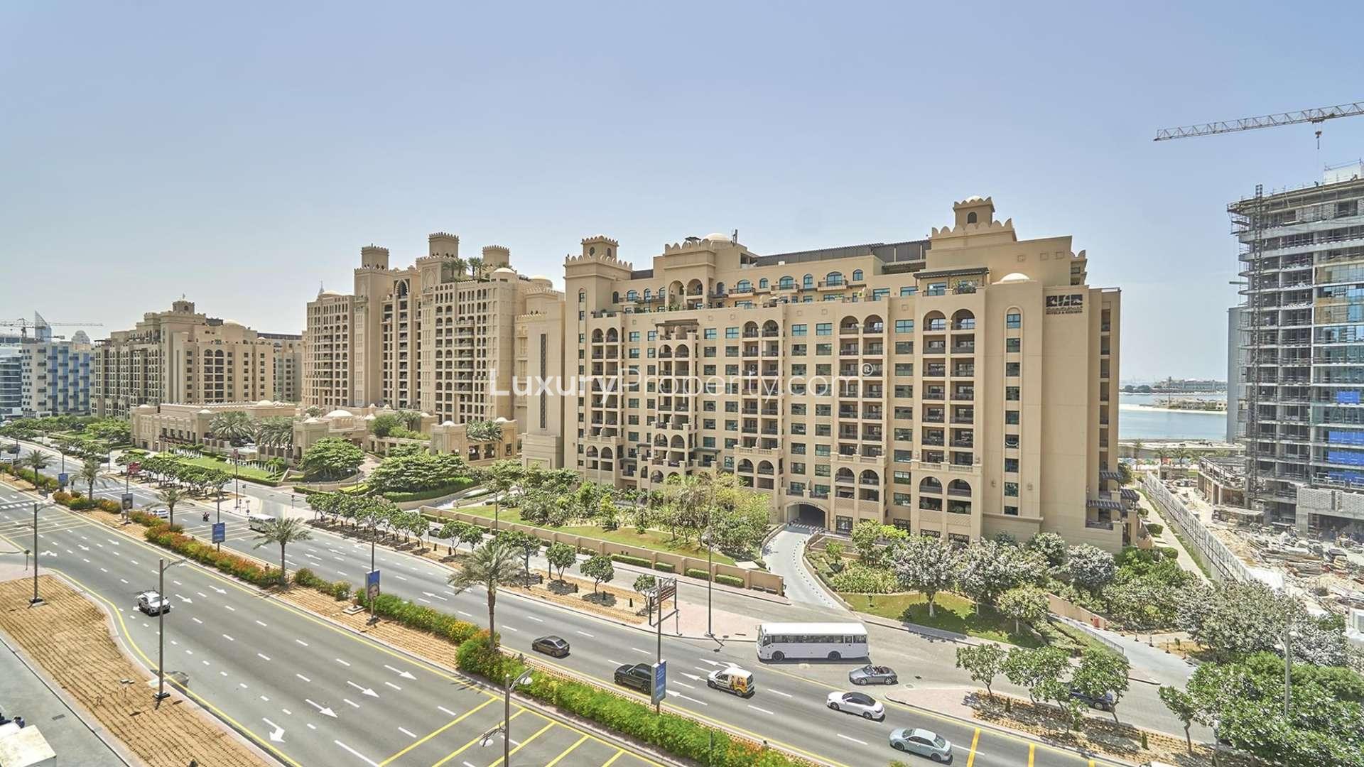 Modern kitchen in Palm Jumeirah apartment, featuring appliances and dining area, Golden Mile community