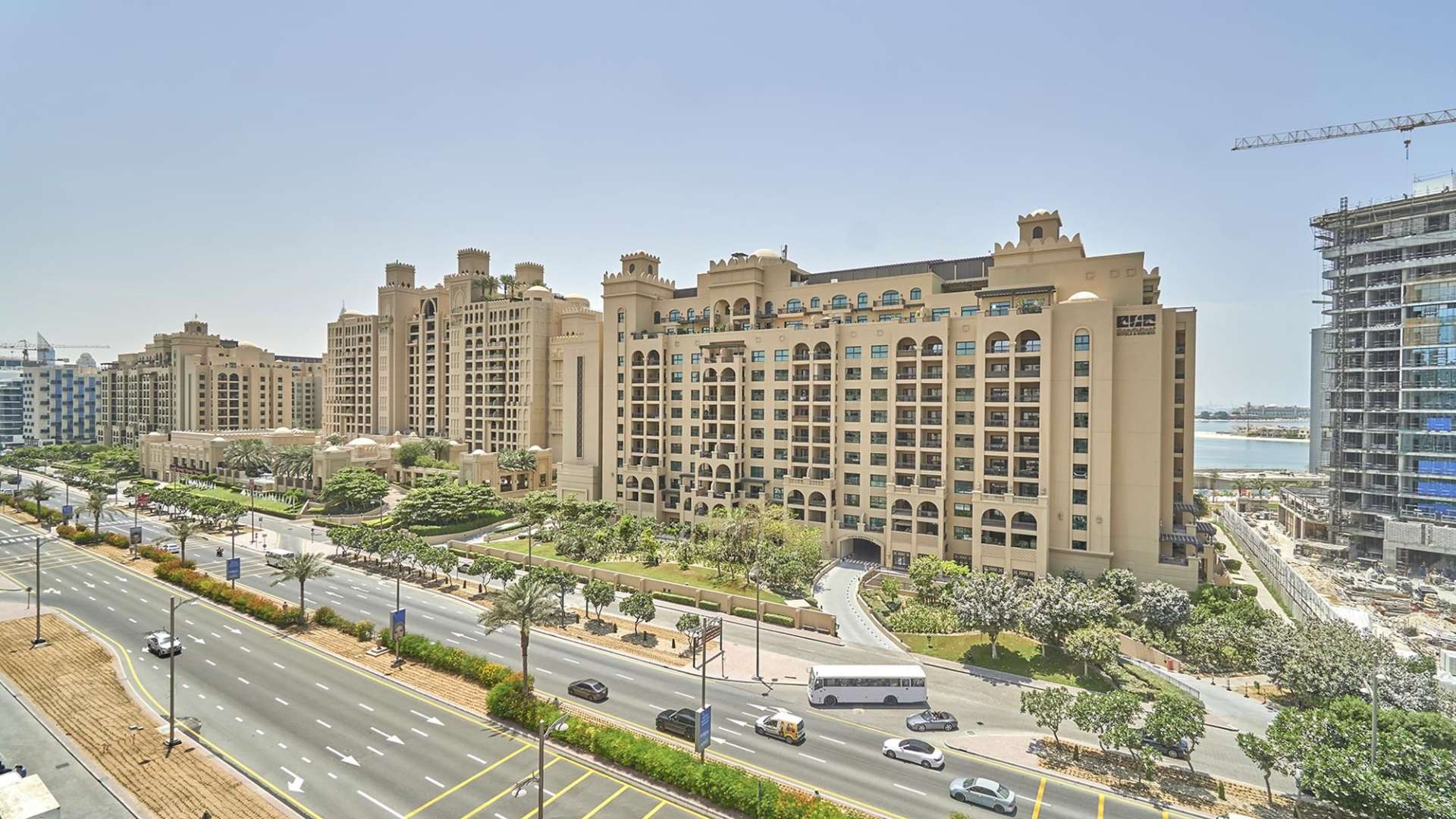 Modern kitchen in Palm Jumeirah apartment, featuring appliances and dining area, Golden Mile community