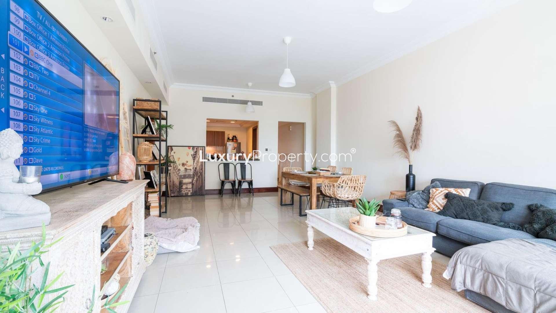 Bright living room in Palm Jumeirah 2-bedroom apartment, featuring stylish decor and natural light