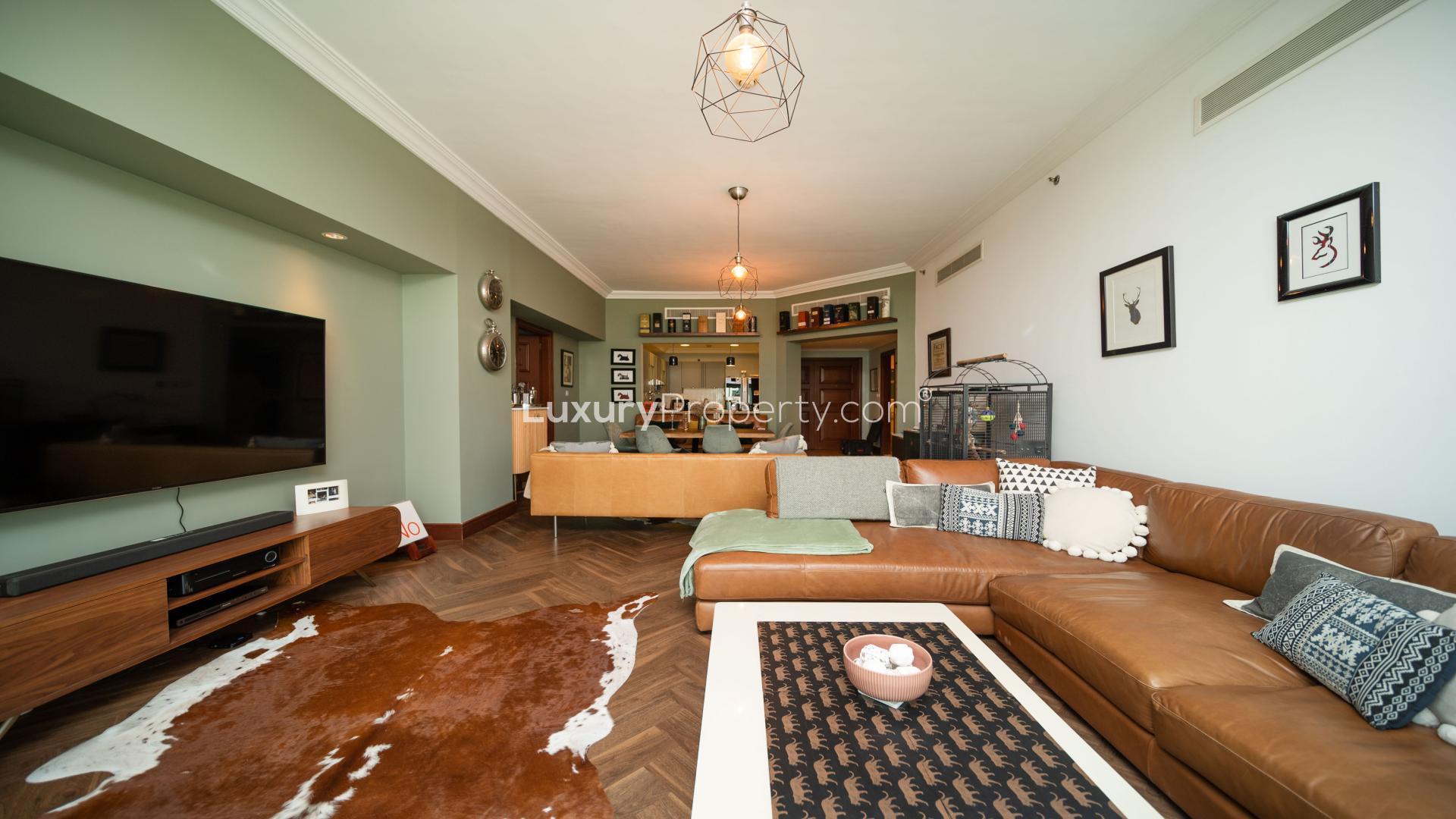 Upgraded living room in 2-bedroom apartment, Golden Mile, Palm Jumeirah, featuring modern decor