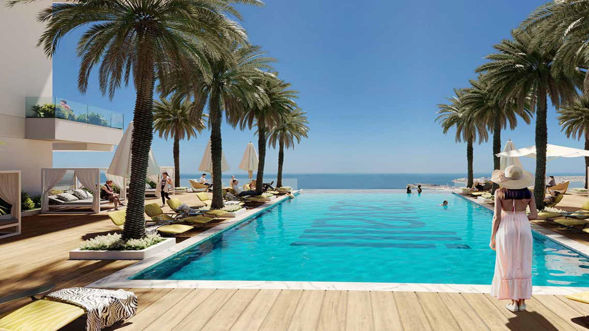 Aerial view of Cavalli Tower pool area in Dubai Marina, showcasing luxury amenities
