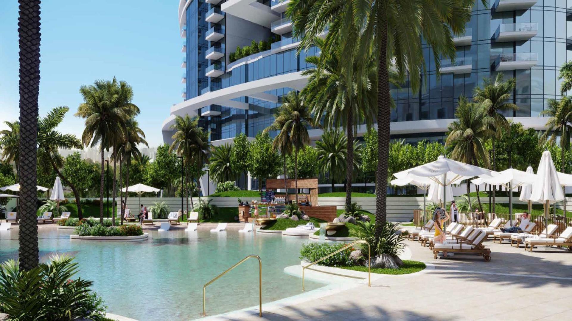 Infinity pool with palm trees at luxury Cavalli Tower, Dubai Marina apartment for sale