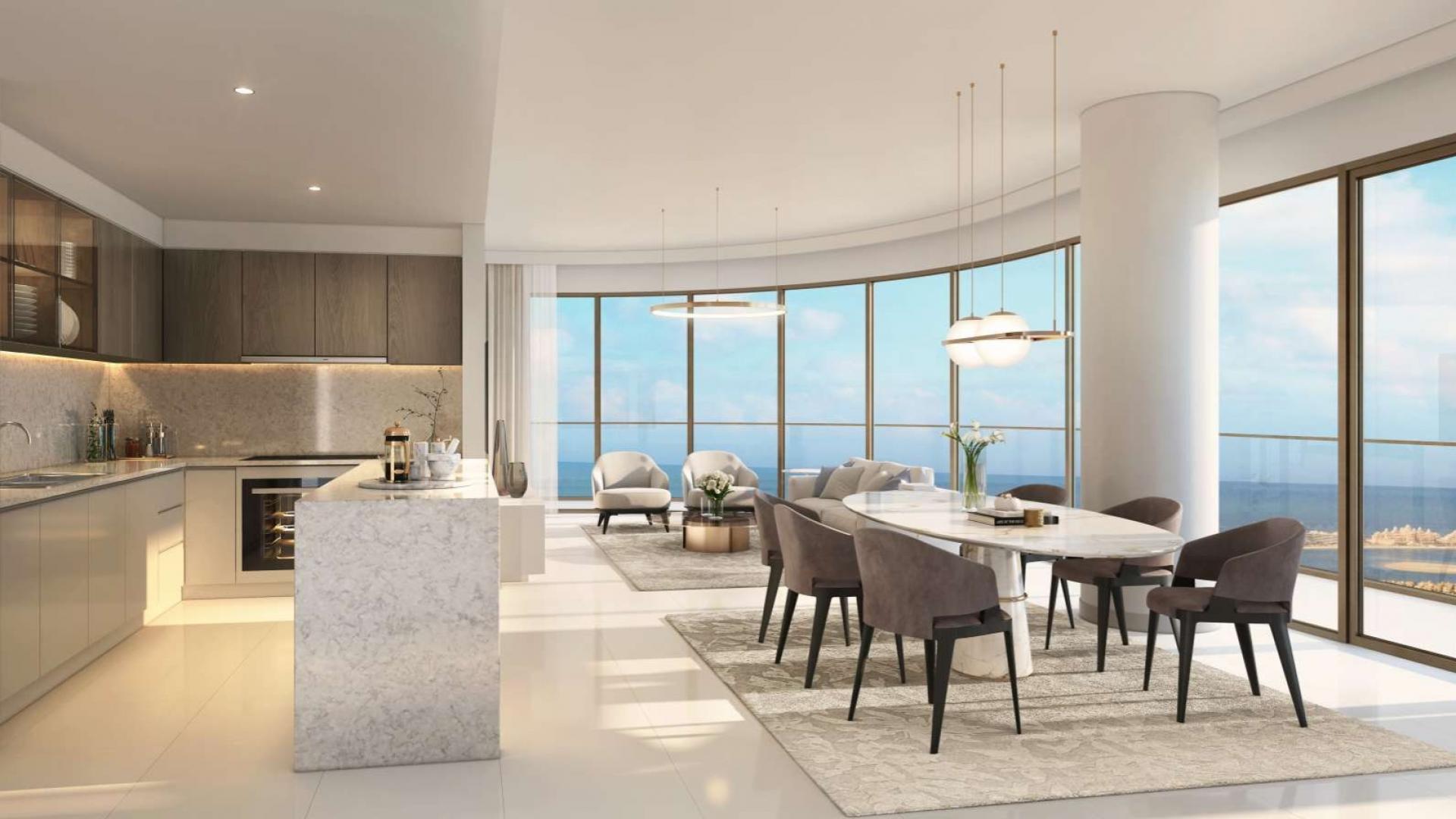Luxurious high-floor apartment dining and kitchen area with ocean views, Emaar Beachfront Dubai