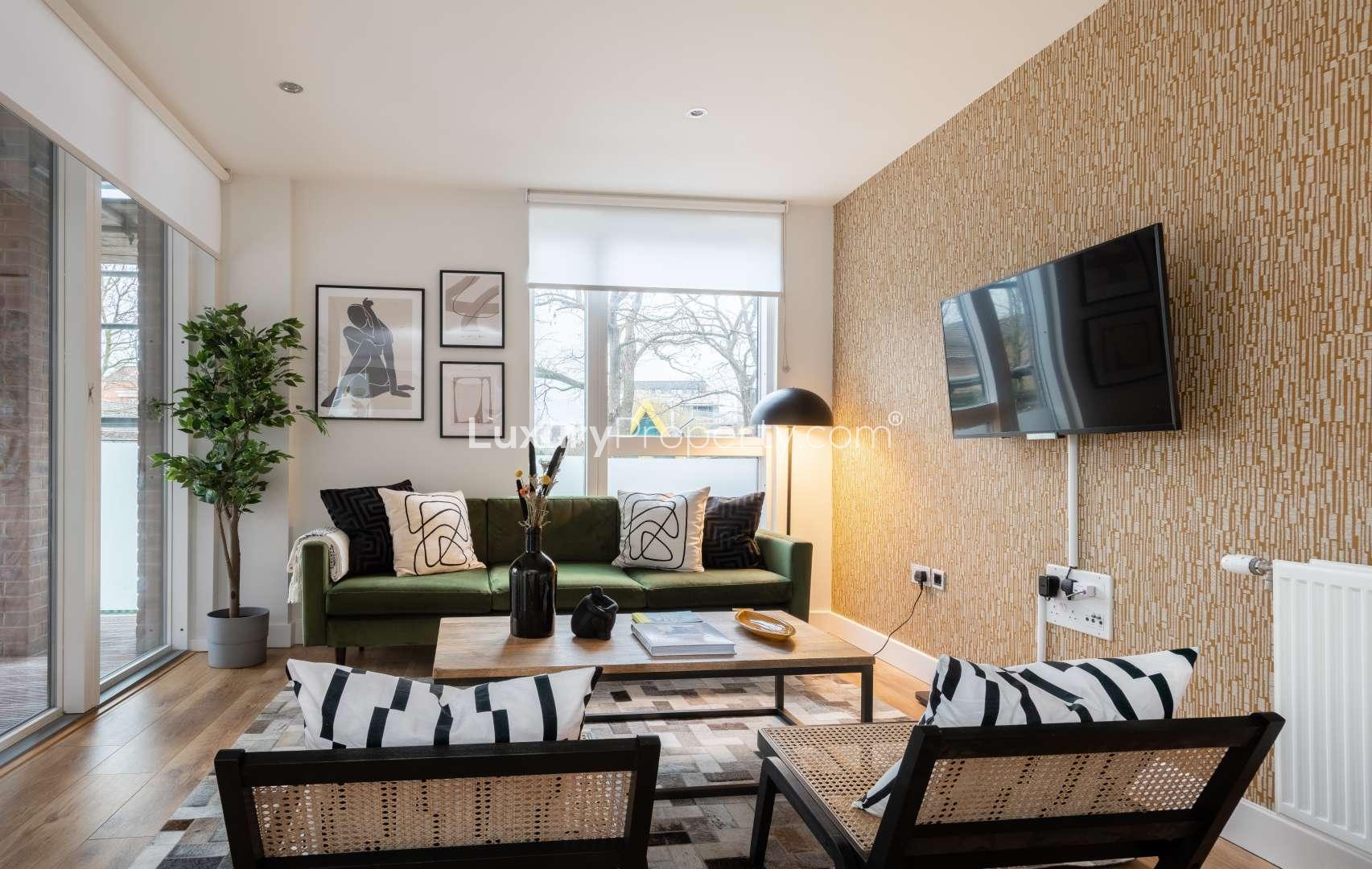 Modern living room in Wharf Mill Apartments, Hoxton, featuring stylish decor and natural light