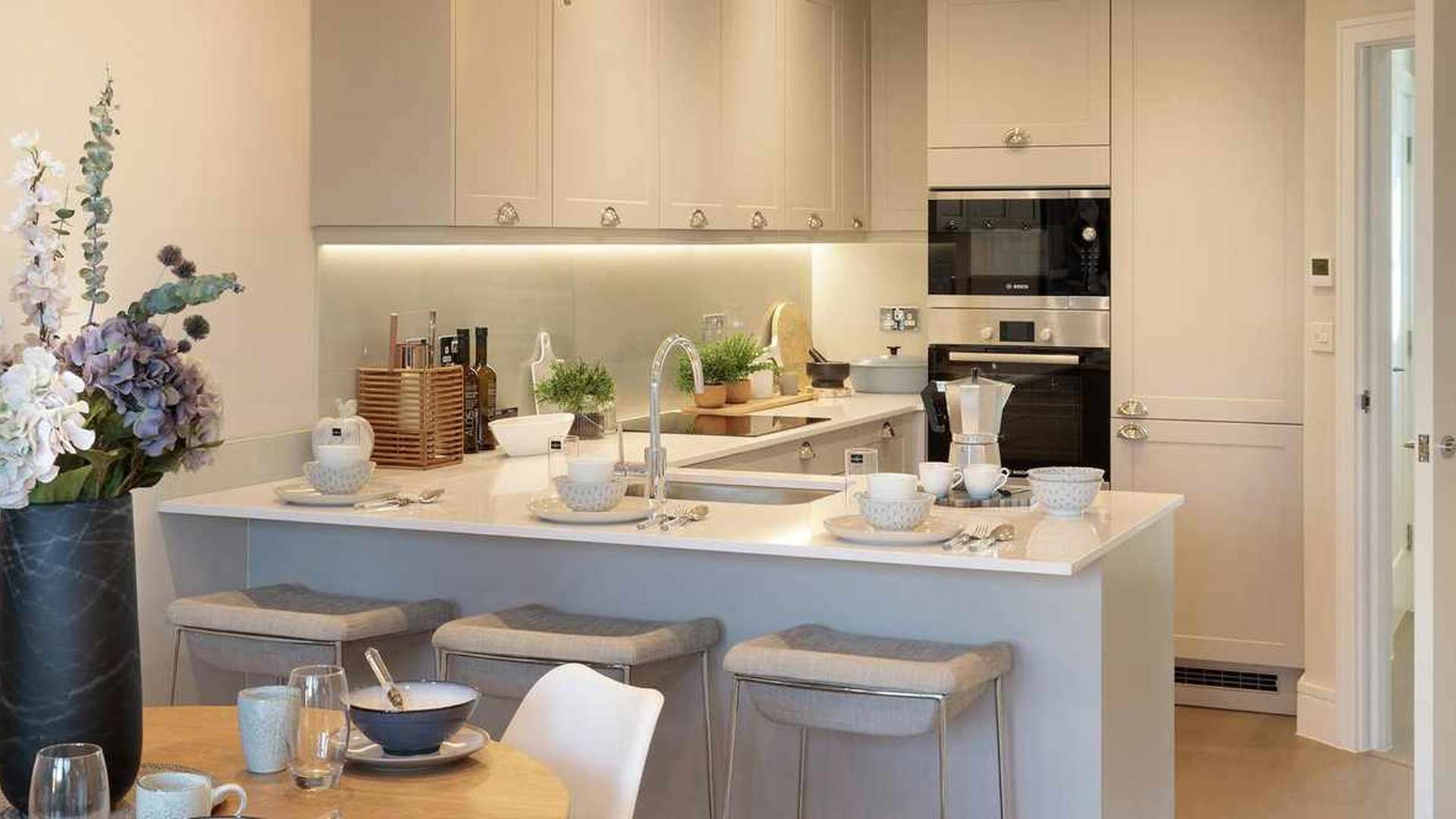 Bright living room in Lakeside Gardens apartment, featuring cozy seating and modern decor