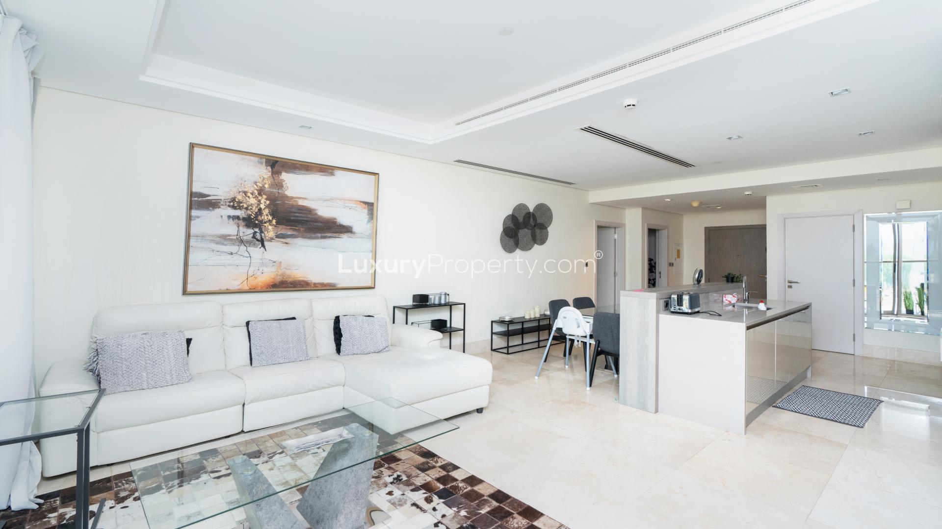 Balcony view from 2-bedroom apartment in The8 Residences, Palm Jumeirah, overlooking open palm scenery