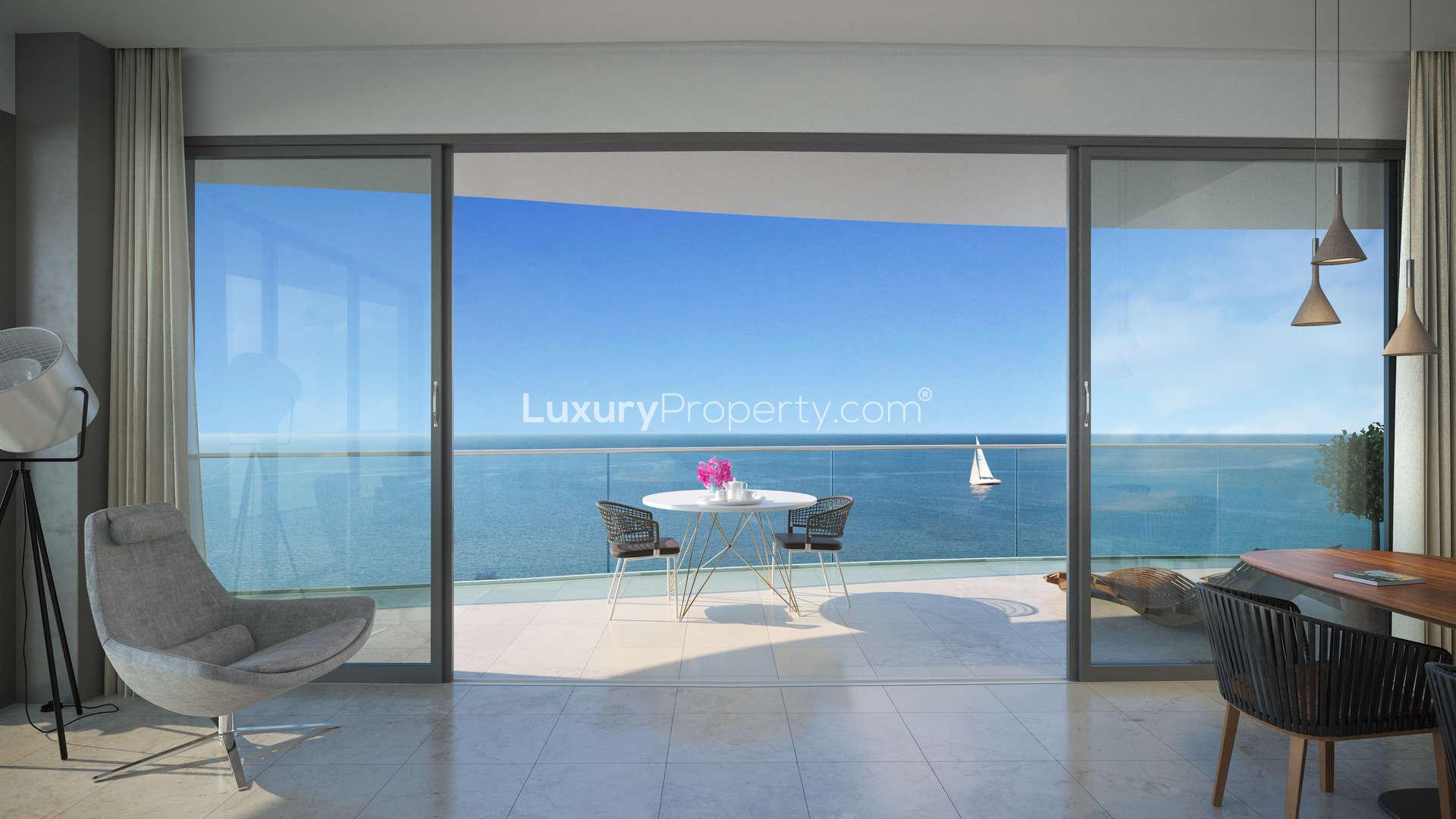 Modern apartment building at Limassol Del Mar, Cyprus, overlooking the sea and cityscape