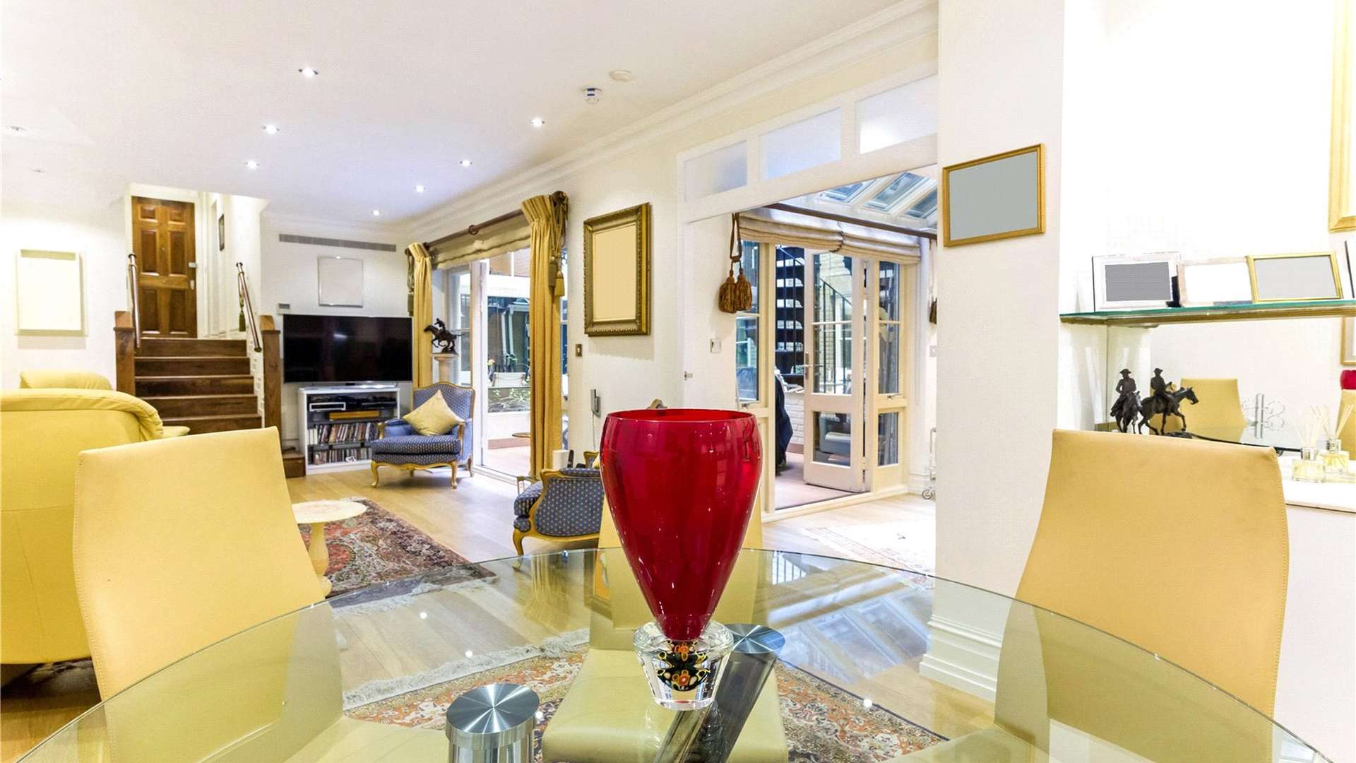 Outdoor patio with spiral staircase at Lowndes Square apartment, Belgravia, London