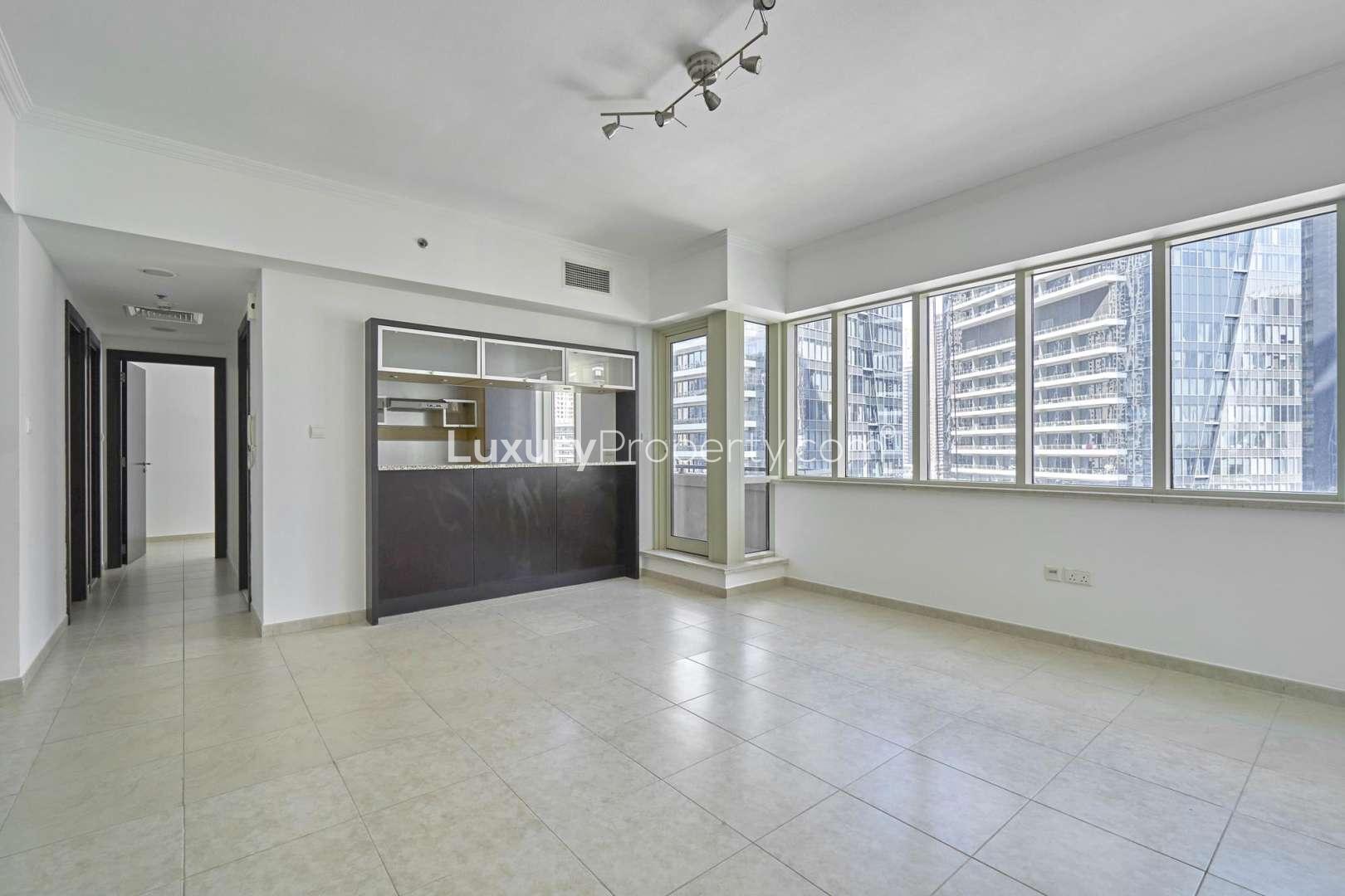 "Al Majara 1 Tower exterior view, Dubai Marina, two-bedroom apartment for sale.","Spacious living area in Al Majara 1, Dubai Marina apartment for sale, bright windows.",Spacious living area in two-bedroom apartment, Al Majara 1 Tower, Dubai Marina for sale