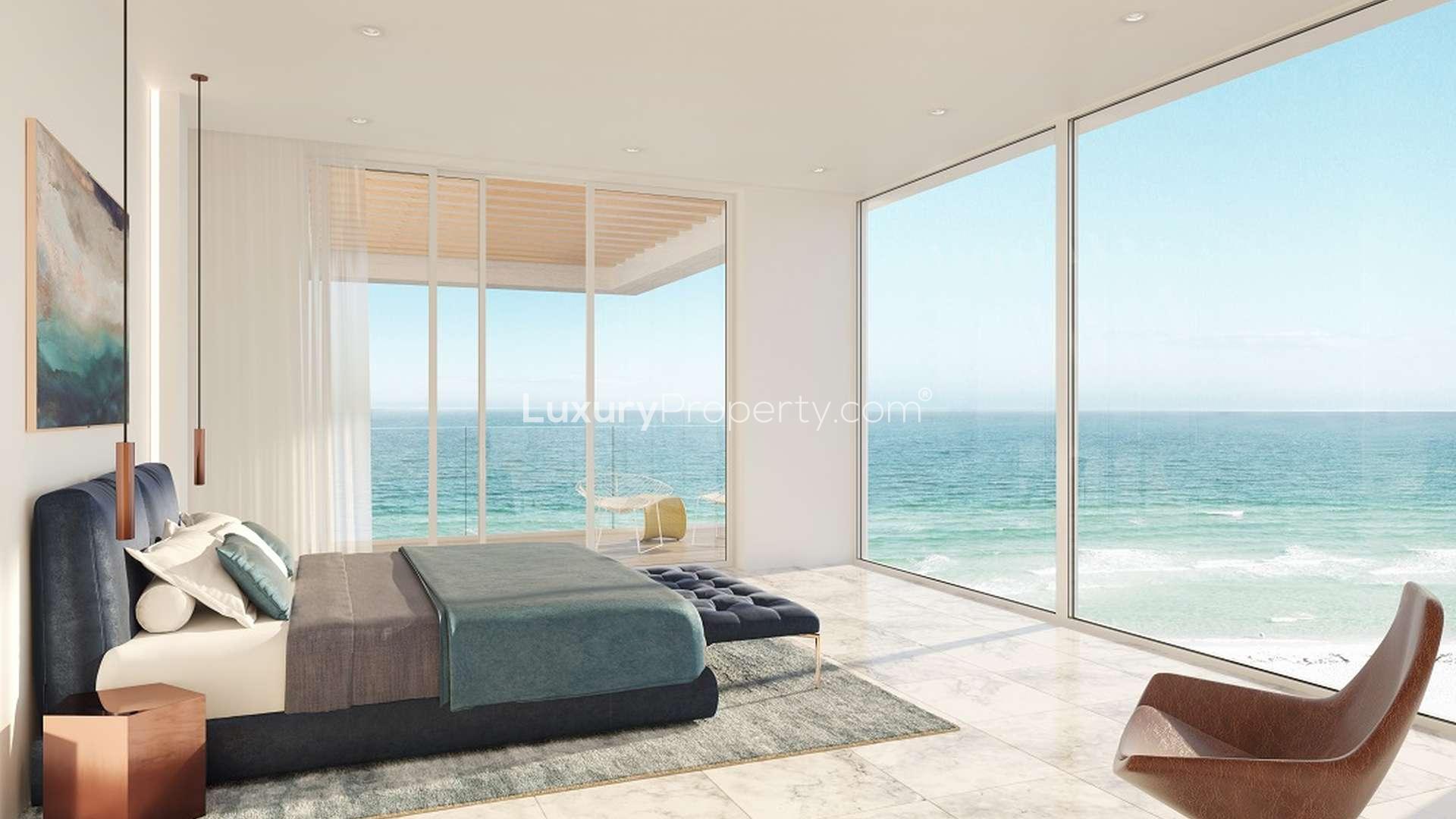 Modern living room with dining area and ocean view at Mamsha Al Saadiyat apartment