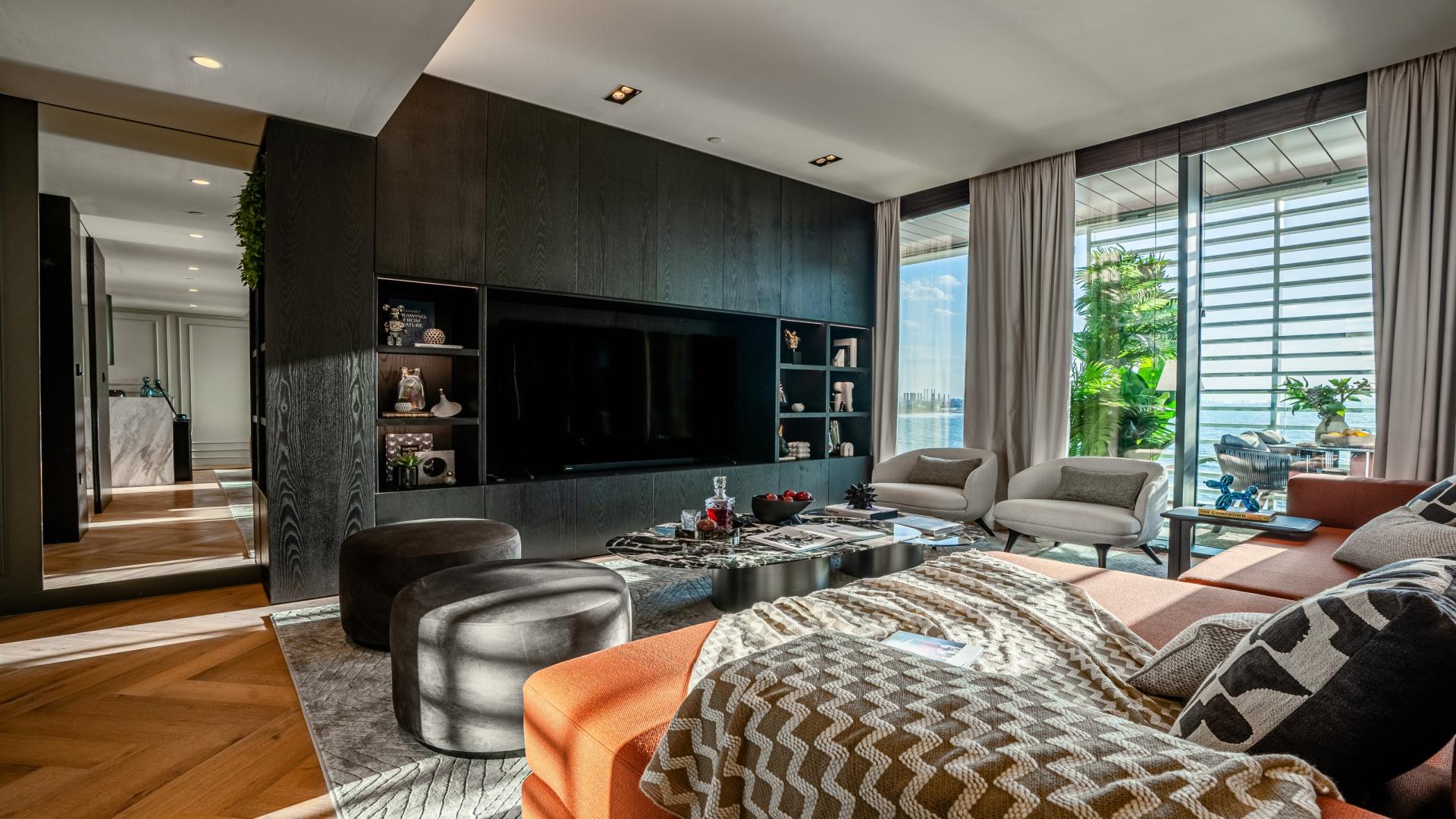 Luxurious bedroom in Bluewaters Residences apartment, featuring modern decor and stunning sea views