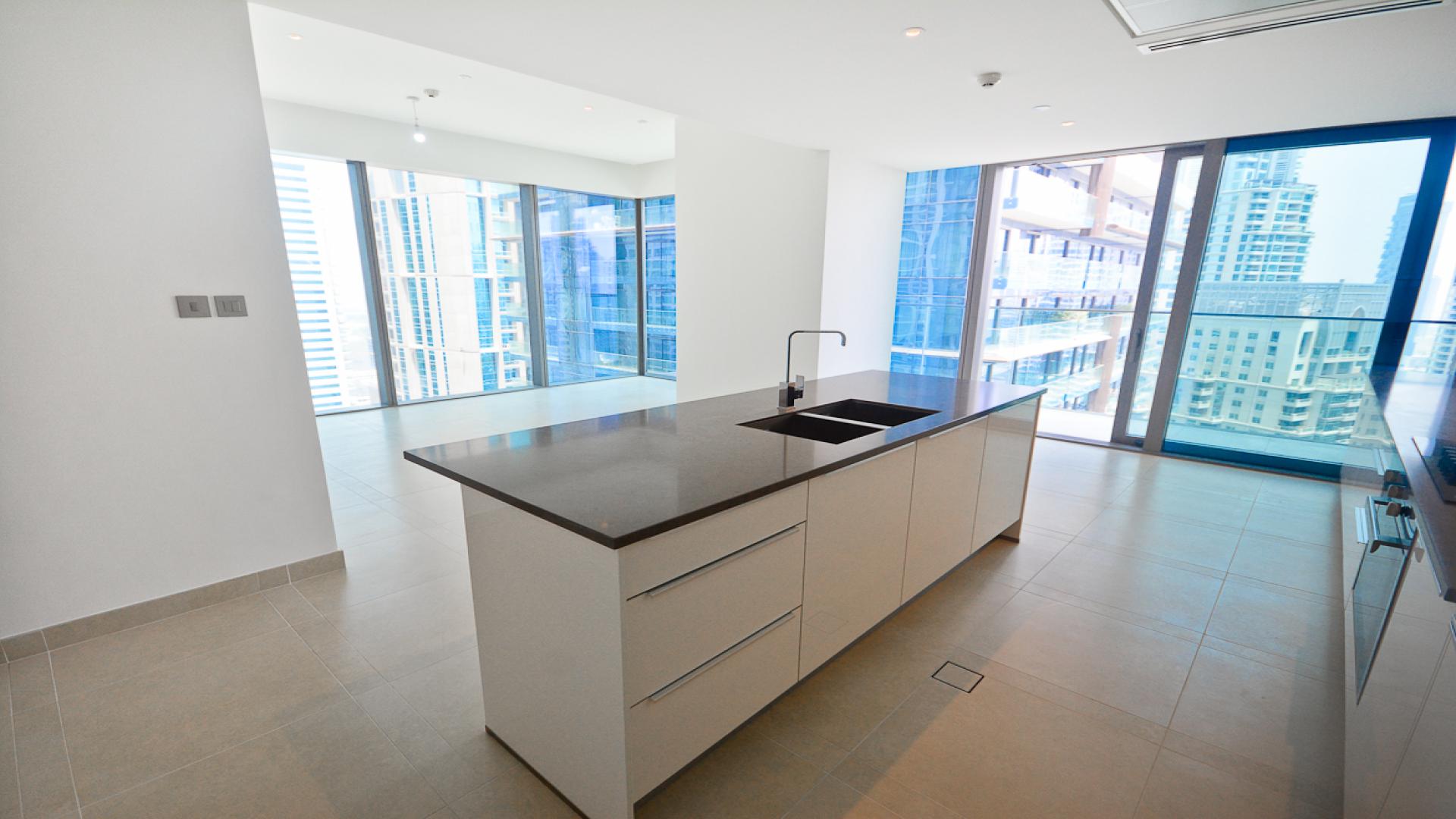 Luxurious open-plan kitchen and living area in Marina Gate Tower apartment, Dubai Marina