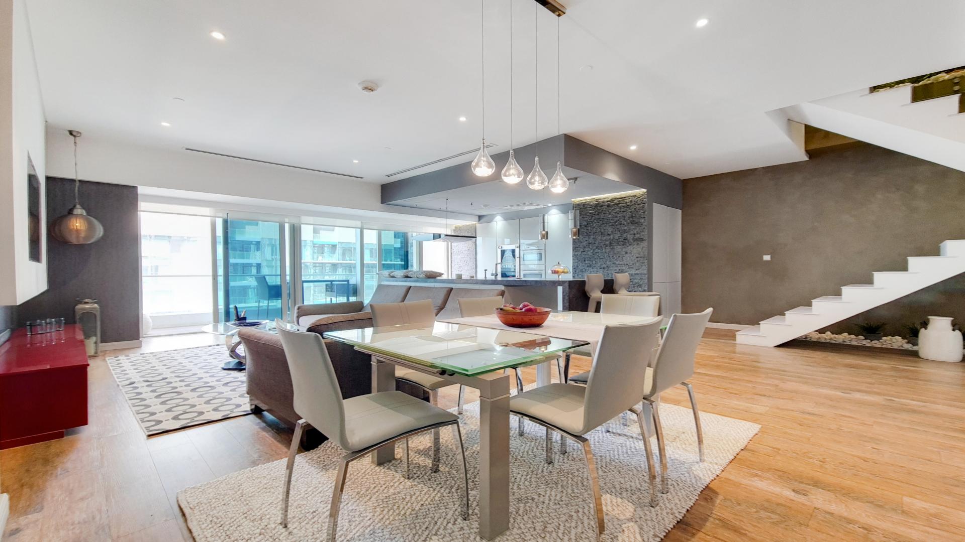 Fully renovated living area in Dubai Marina duplex apartment, modern decor, open kitchen design