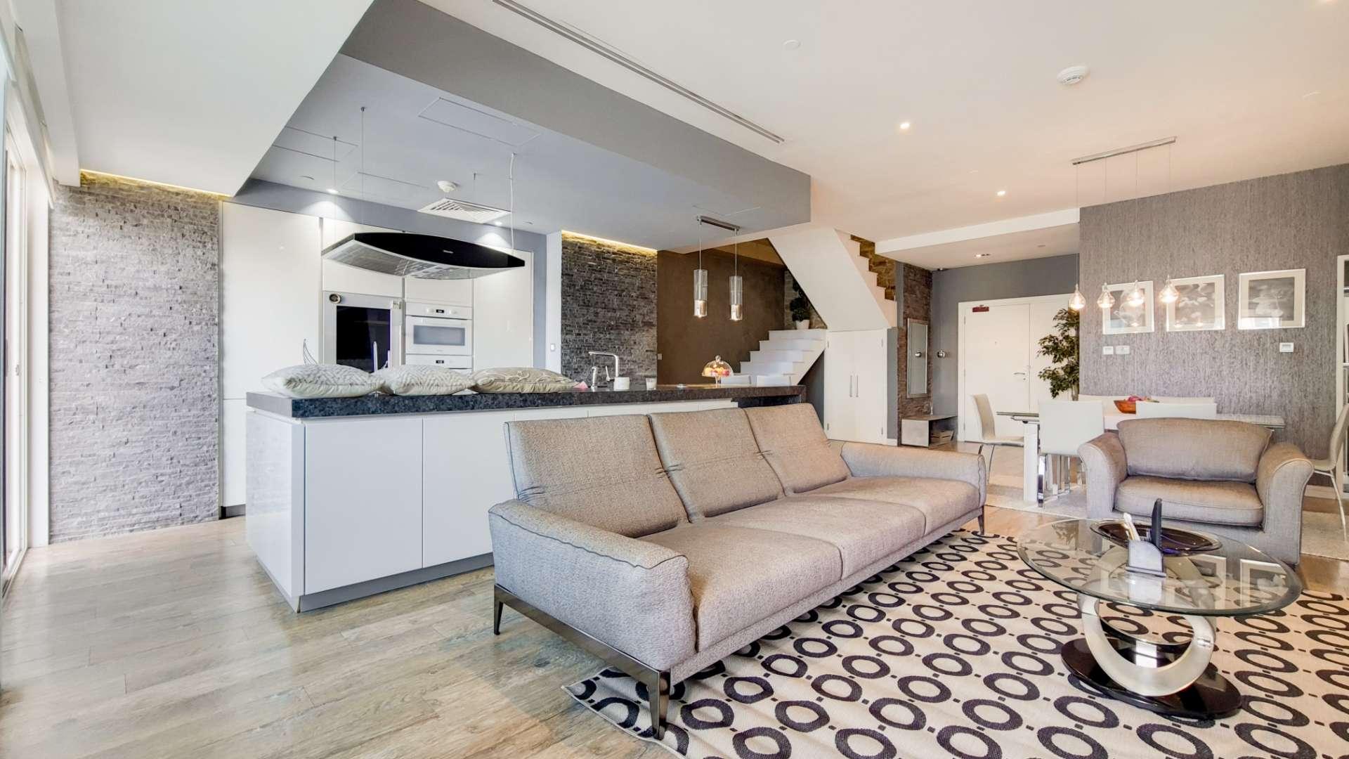 Modern open-plan living area in renovated duplex, Dubai Marina apartment, Marina Heights